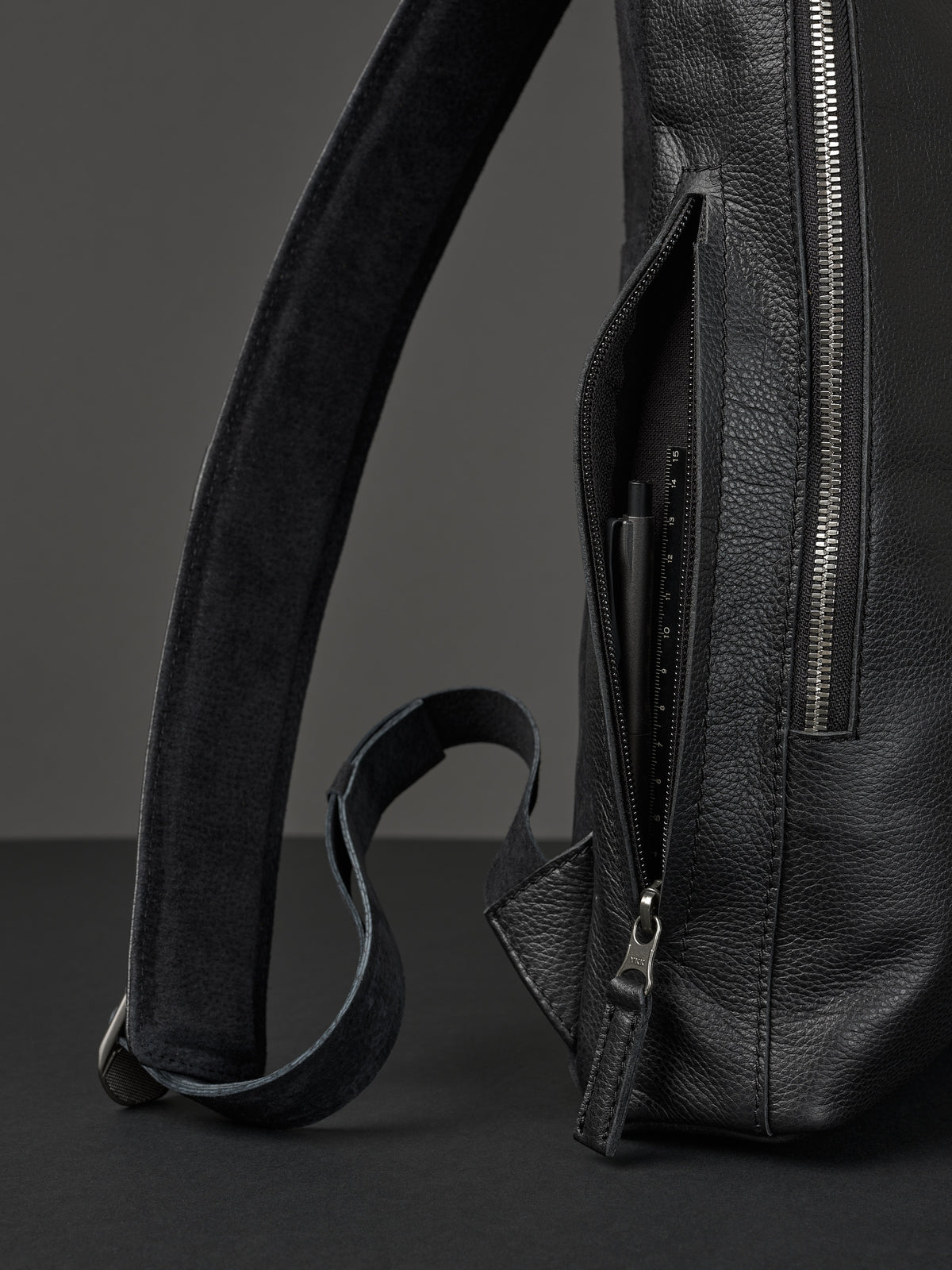 Professional backpack for men. Men's style. Men's fashion. Premium backpack for men. Side pocket for easy access. Everyday backpack. Padded shoulder straps for comfort. Memory foam padded strap for men. Quality materials for durability and style. Made in leather and suede by Capra Leather.