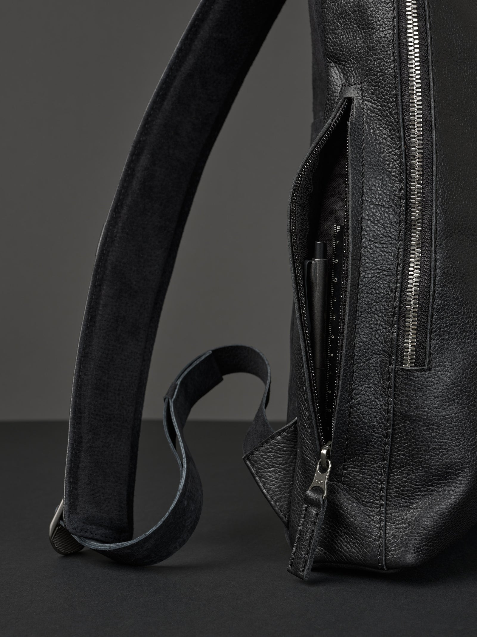 Professional backpack for men. Men's style. Men's fashion. Premium backpack for men. Side pocket for easy access. Everyday backpack. Padded shoulder straps for comfort. Memory foam padded strap for men. Quality materials for durability and style. Made in leather and suede by Capra Leather.