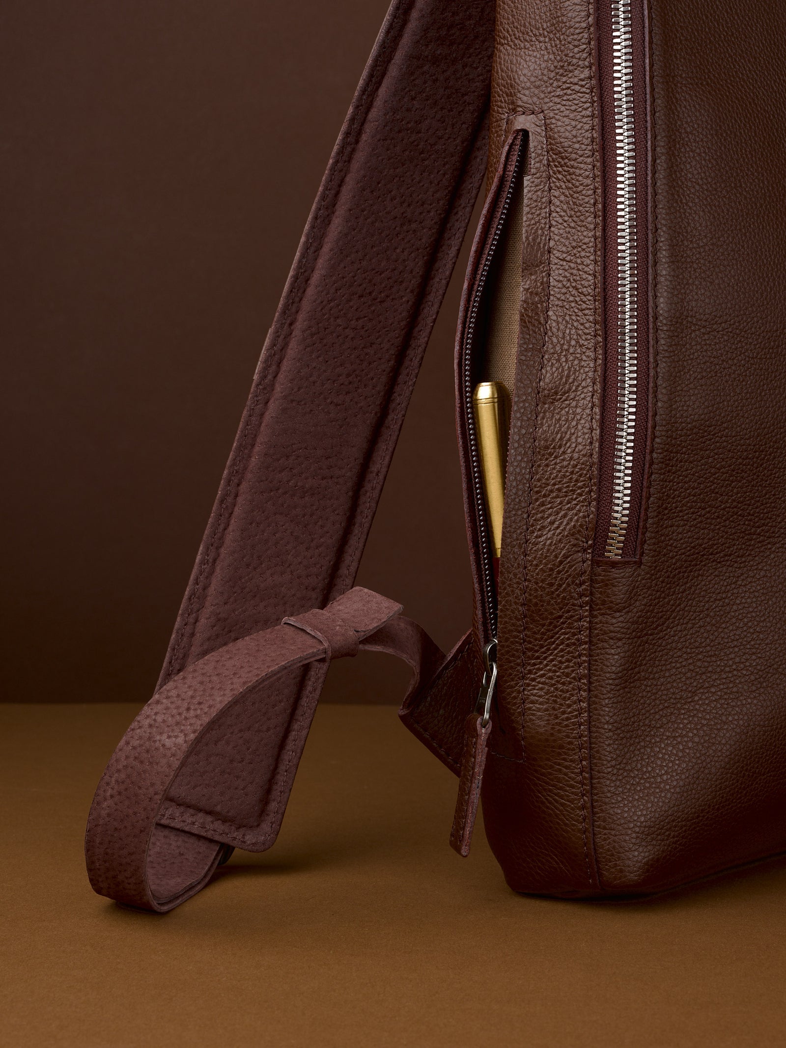 Professional backpack for men. Men's style. Men's fashion. Premium backpack for men. Side pocket for easy access. Everyday backpack. Padded shoulder straps for comfort. Memory foam padded strap for men. Quality materials for durability and style. Made in leather and suede by Capra Leather.