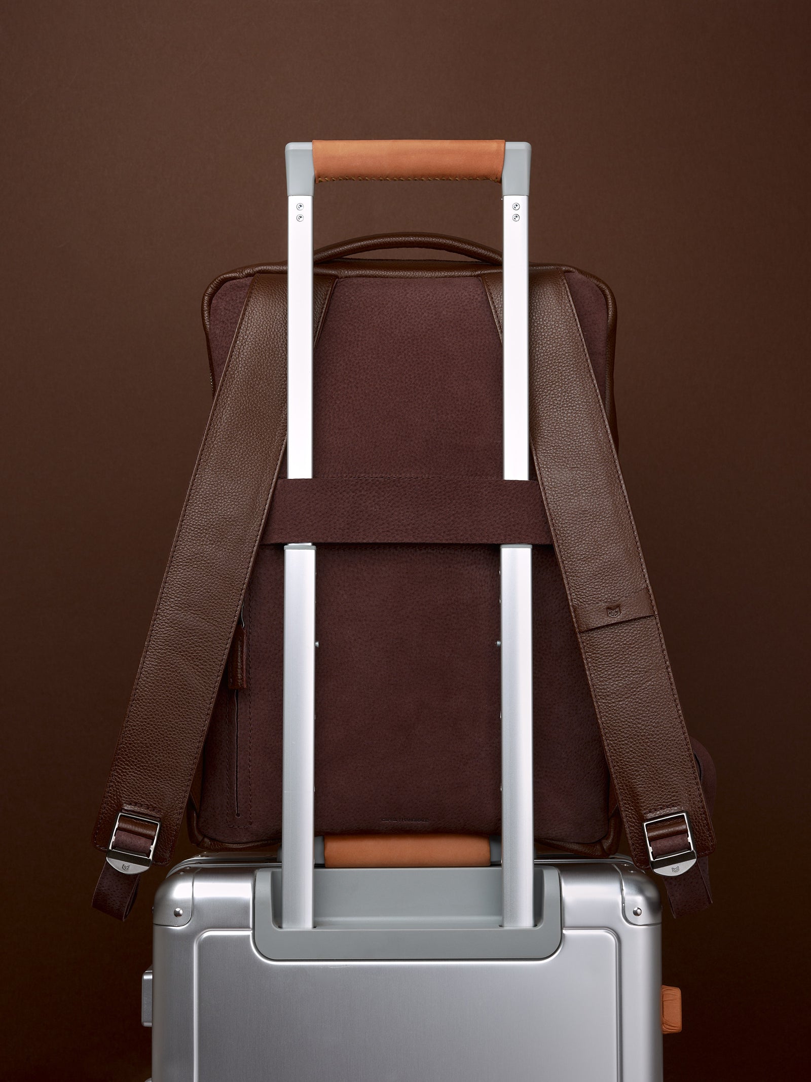 Suede and leather backpack made for men. Soft finish in leather. Invisible luggage strap for easy travel on plane. Comfortable and soft feeling. Premium materials. Made in leather by Capra Leather.