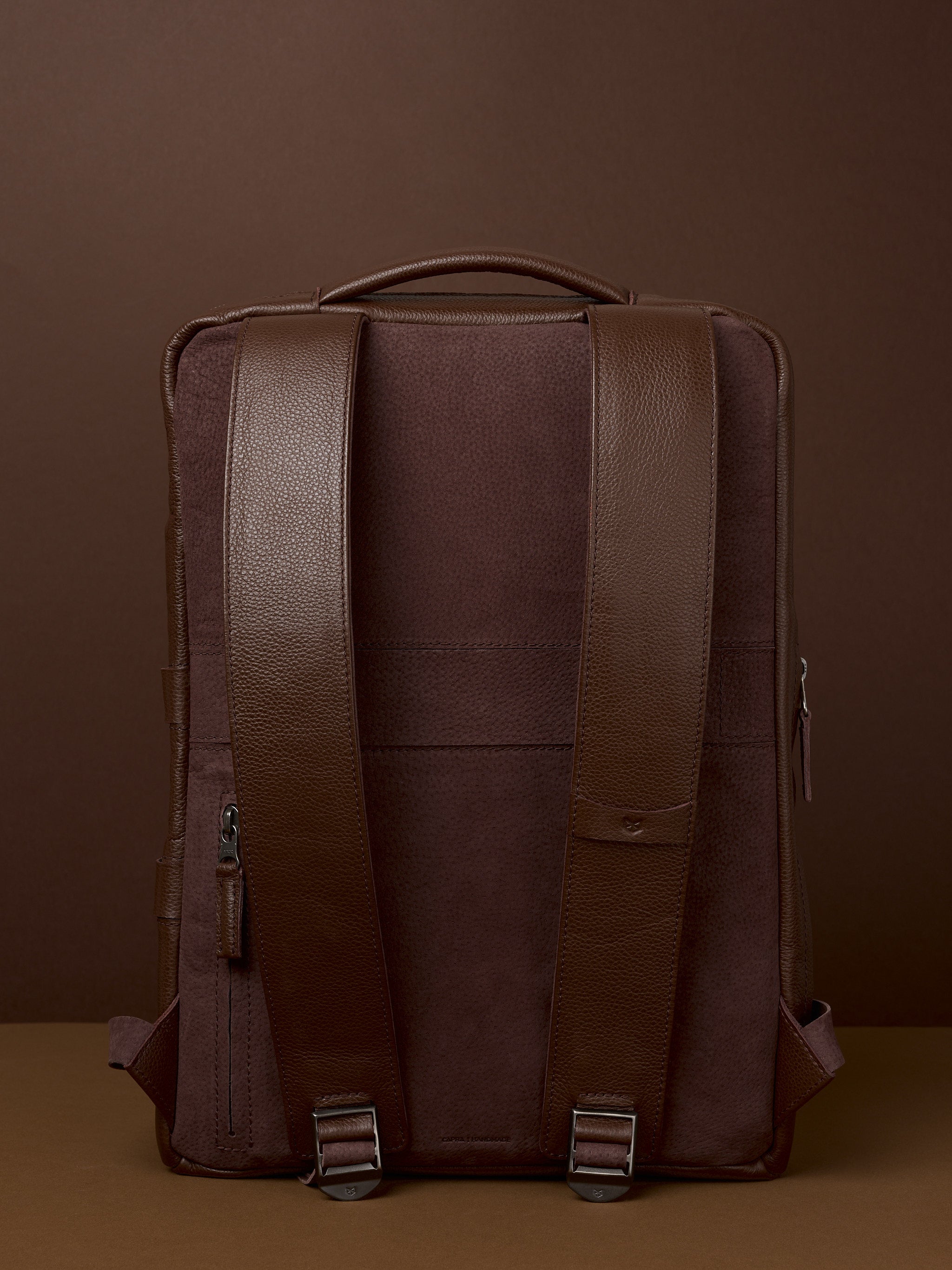 brown faux leather backpack top flap snap closure Saola Tech Backpack · Brown by Capra Leather