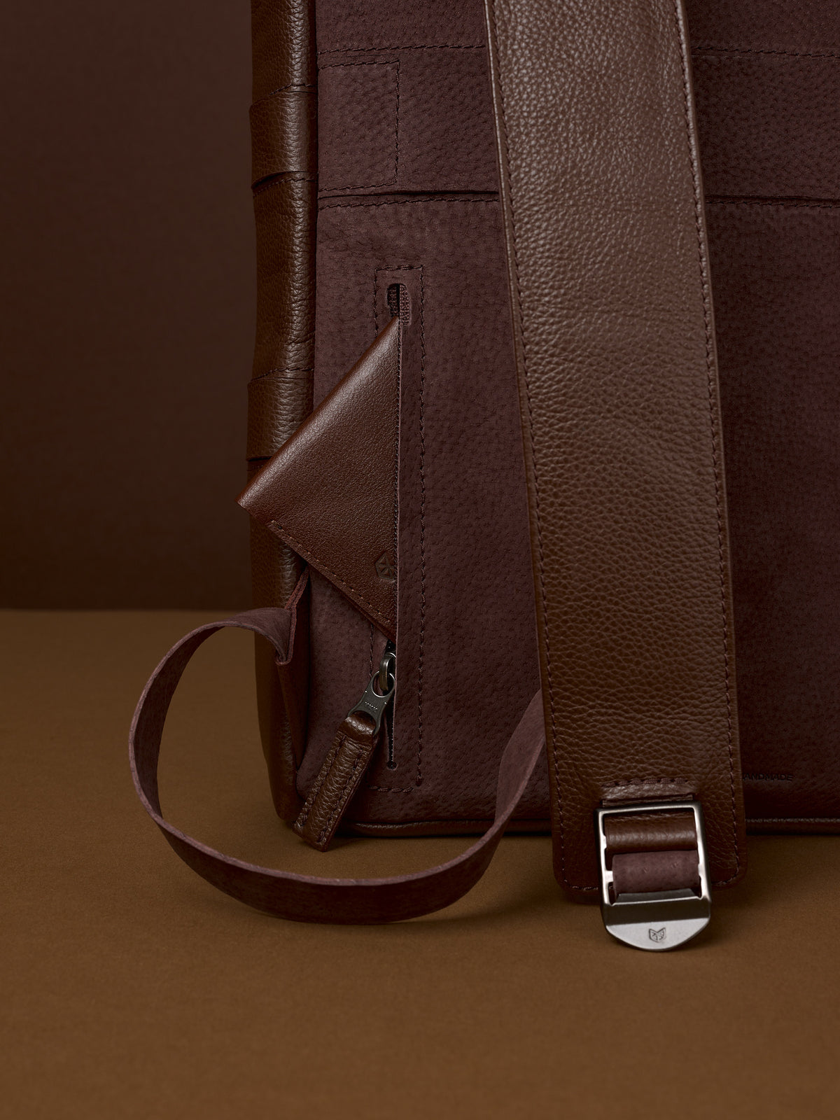 Hidden pocket in the back for easy access. Soft finish made in suede and leather. Premium materials. Double D Ring system for quick adjustments. Men's backpack for style and durability. Made in quality materials by Capra Leather.