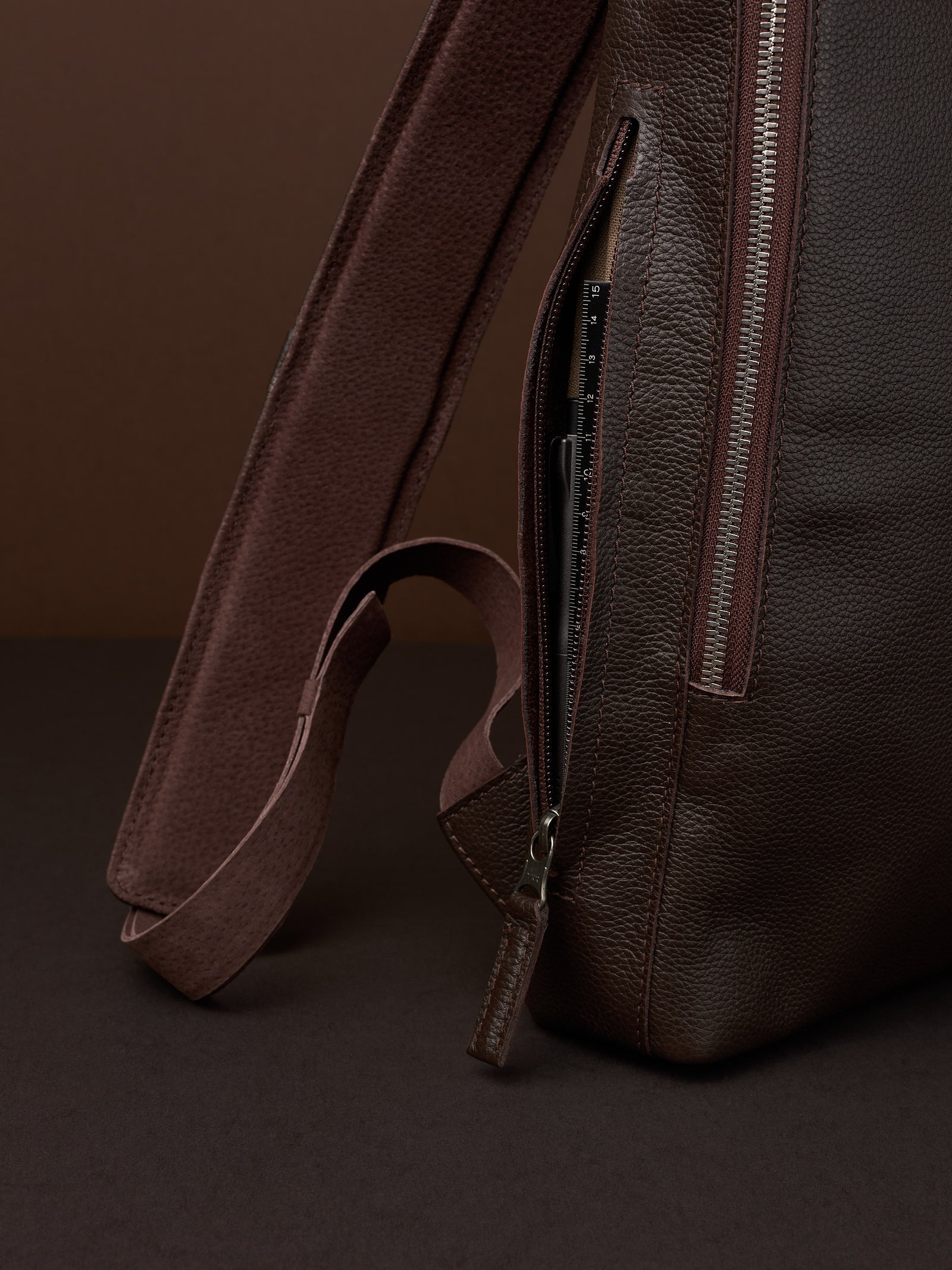 Professional backpack for men. Men's style. Men's fashion. Premium backpack for men. Side pocket for easy access. Everyday backpack. Padded shoulder straps for comfort. Memory foam padded strap for men. Quality materials for durability and style. Made in leather and suede by Capra Leather.