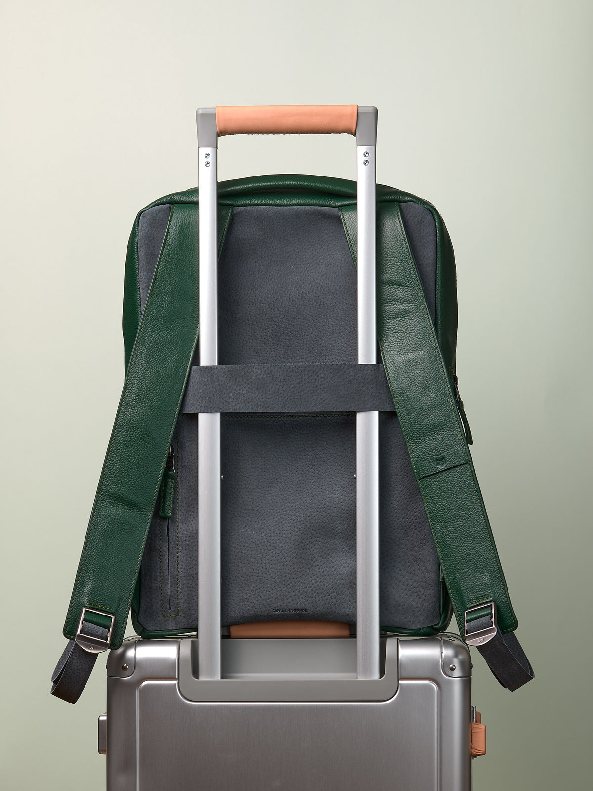 Suede and leather backpack made for men. Soft finish in leather. Invisible luggage strap for easy travel on plane. Comfortable and soft feeling. Premium materials. Made in leather by Capra Leather.