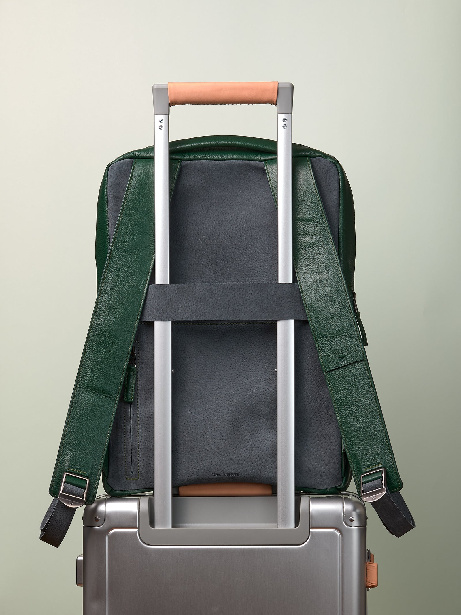 Suede and leather backpack made for men. Soft finish in leather. Invisible luggage strap for easy travel on plane. Comfortable and soft feeling. Premium materials. Made in leather by Capra Leather.