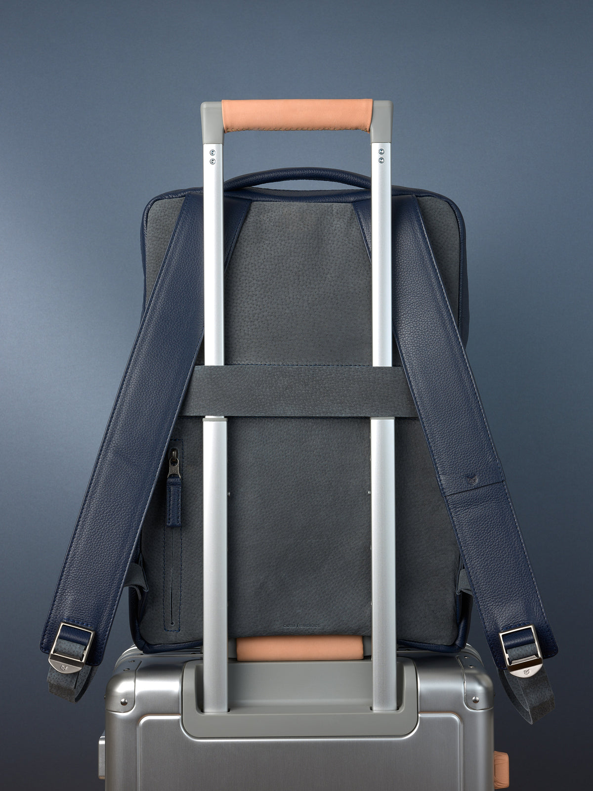 Suede and leather backpack made for men. Soft finish in leather. Invisible luggage strap for easy travel on plane. Comfortable and soft feeling. Premium materials. Made in leather by Capra Leather.