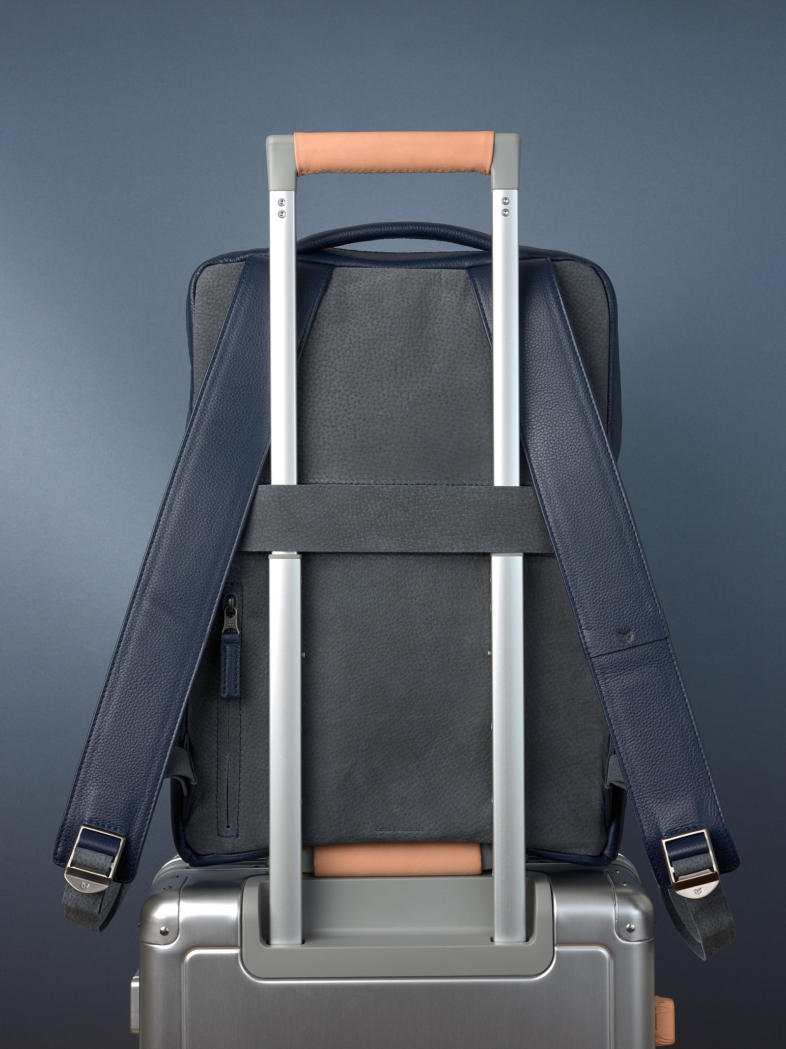 Suede and leather backpack made for men. Soft finish in leather. Invisible luggage strap for easy travel on plane. Comfortable and soft feeling. Premium materials. Made in leather by Capra Leather.