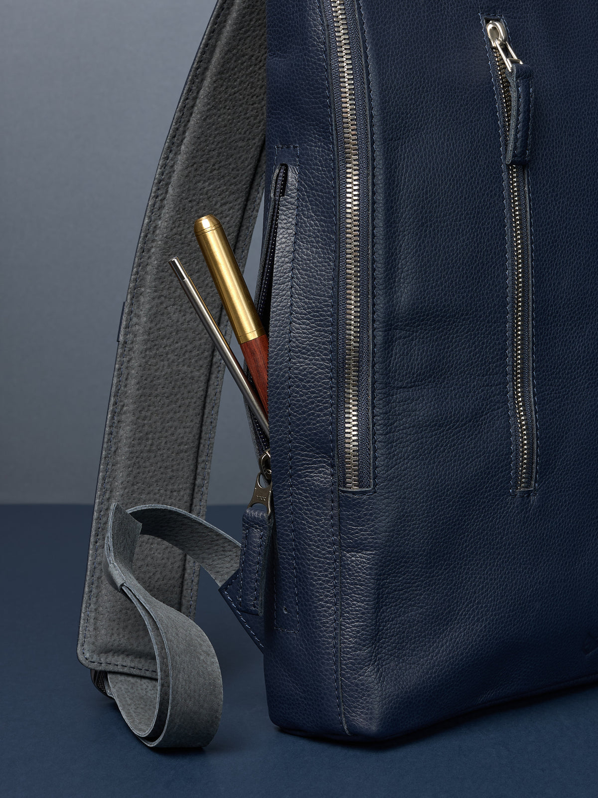 Professional backpack for men. Men's style. Men's fashion. Premium backpack for men. Side pocket for easy access. Everyday backpack. Padded shoulder straps for comfort. Memory foam padded strap for men. Quality materials for durability and style. Made in leather and suede by Capra Leather.