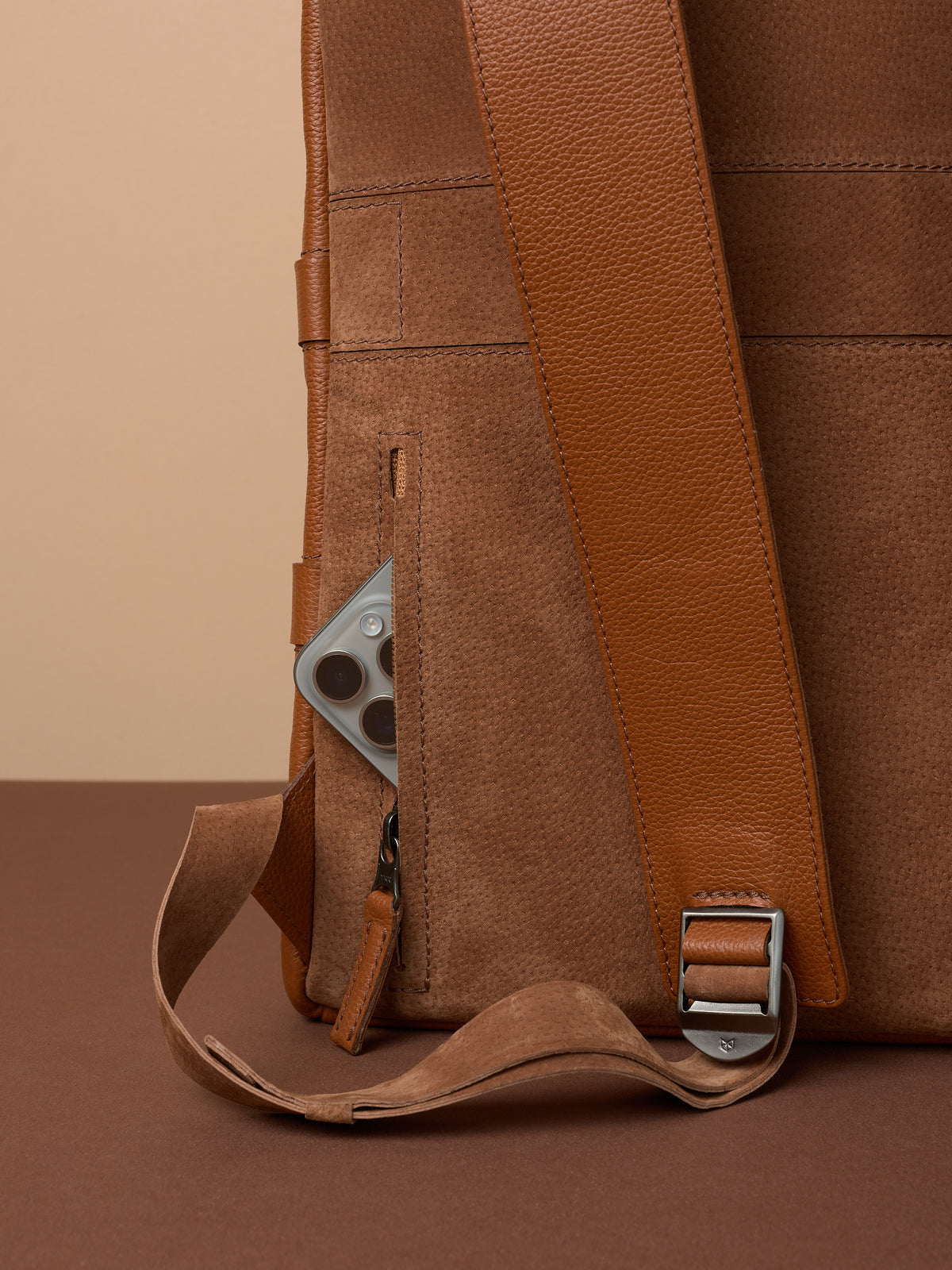 Hidden pocket in the back for easy access. Soft finish made in suede and leather. Premium materials. Double D Ring system for quick adjustments. Men's backpack for style and durability. Made in quality materials by Capra Leather.