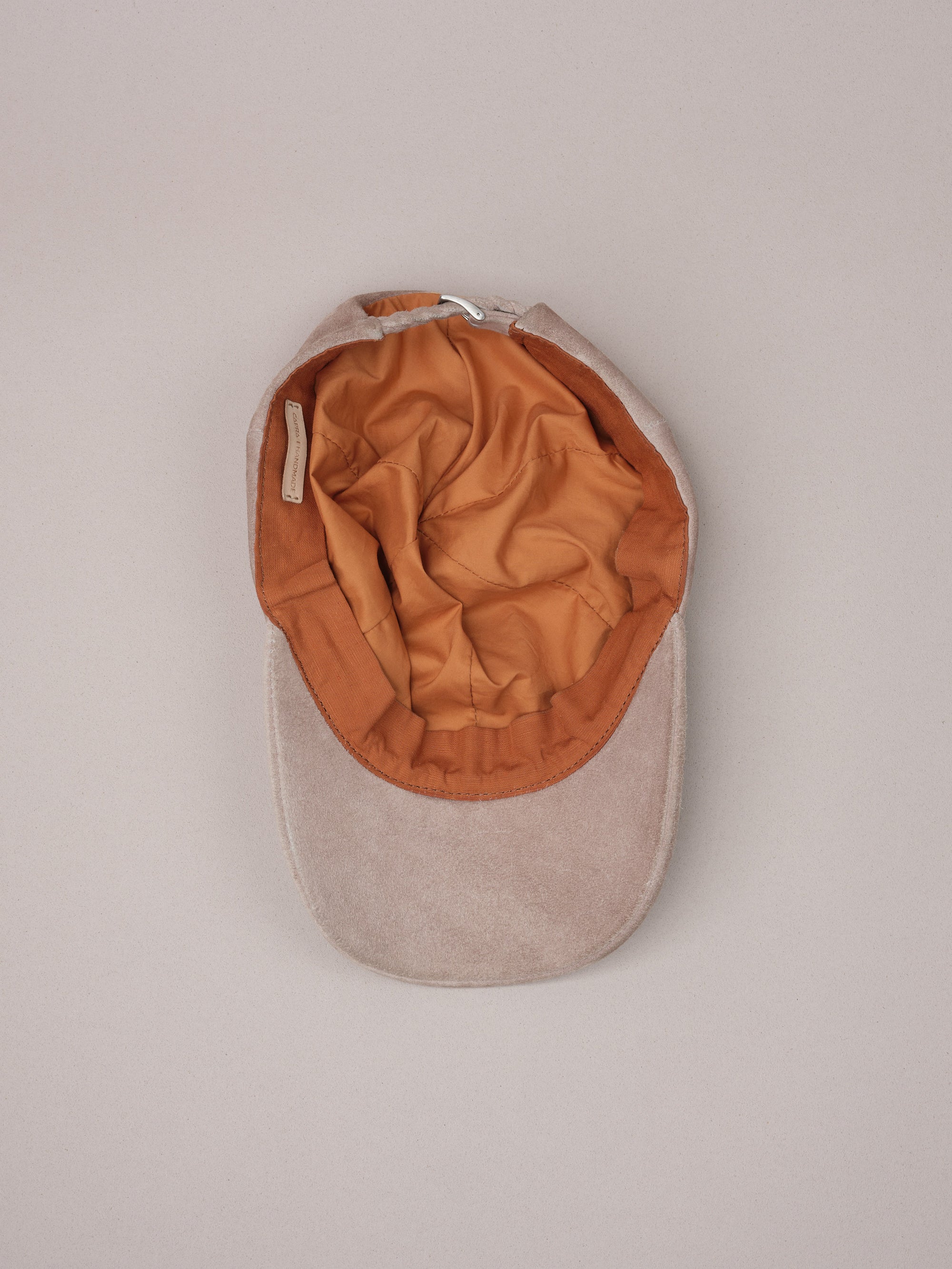 Soft natural linen lining inside the stone suede baseball cap.