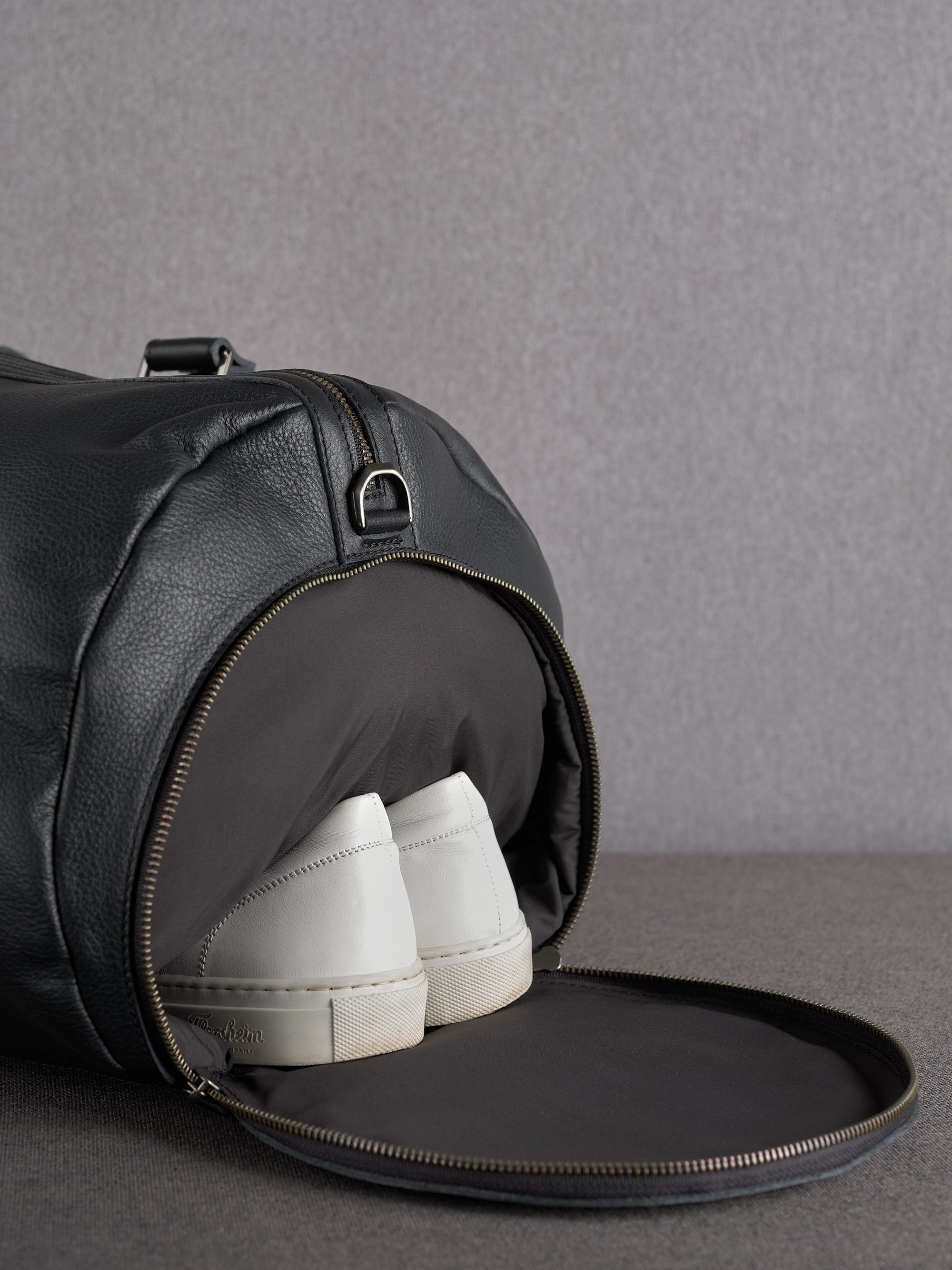 Black duffle bag shoe compartment by Capra Leather
