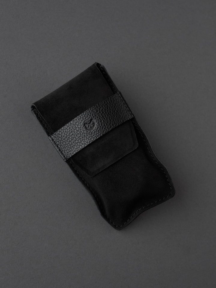 Capra Leather black suede watch pouch with a distinct leather band. Made in leather by Capra Leather.