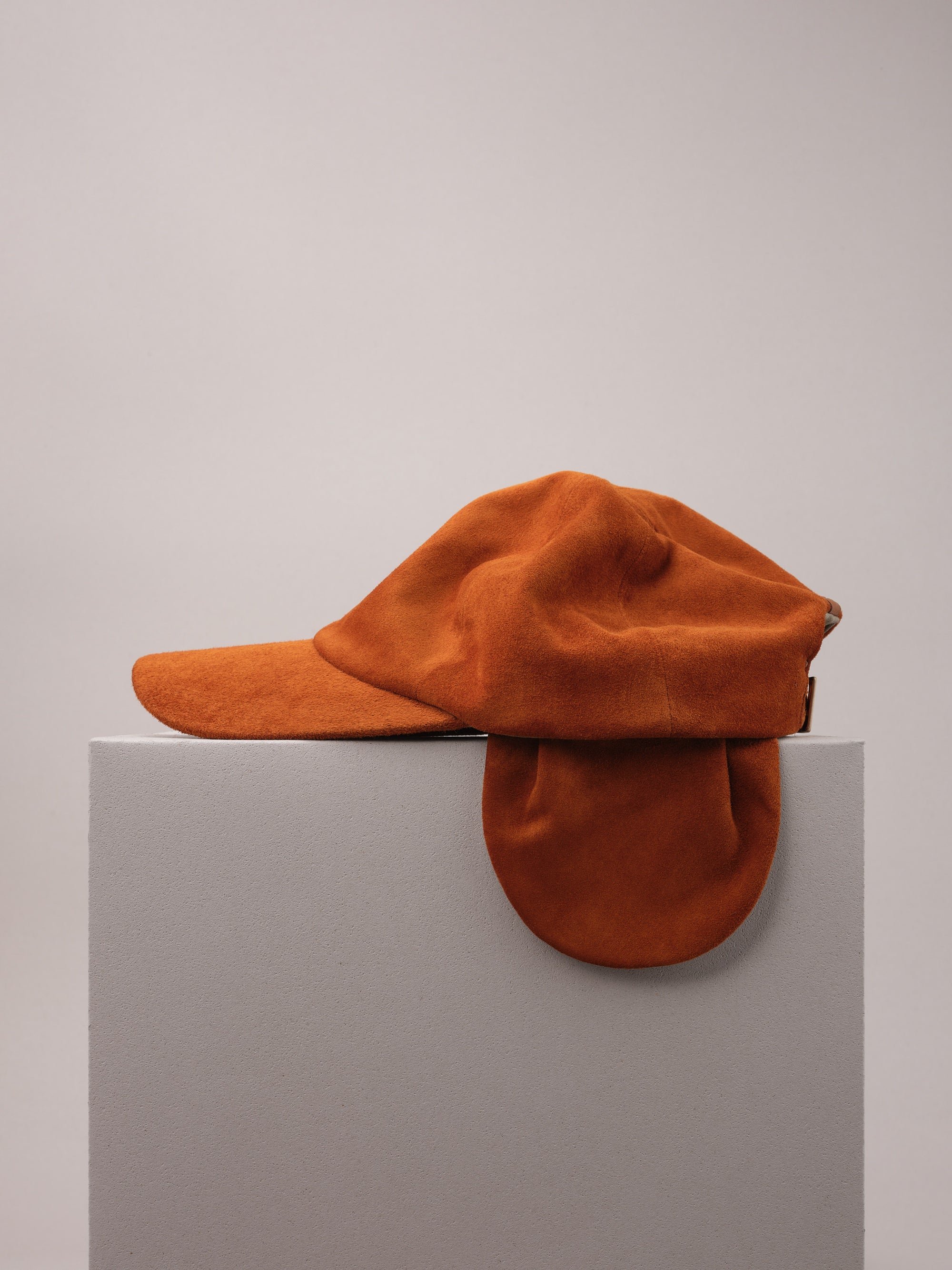 Tan Suede Cap with Removable Ear Flaps.