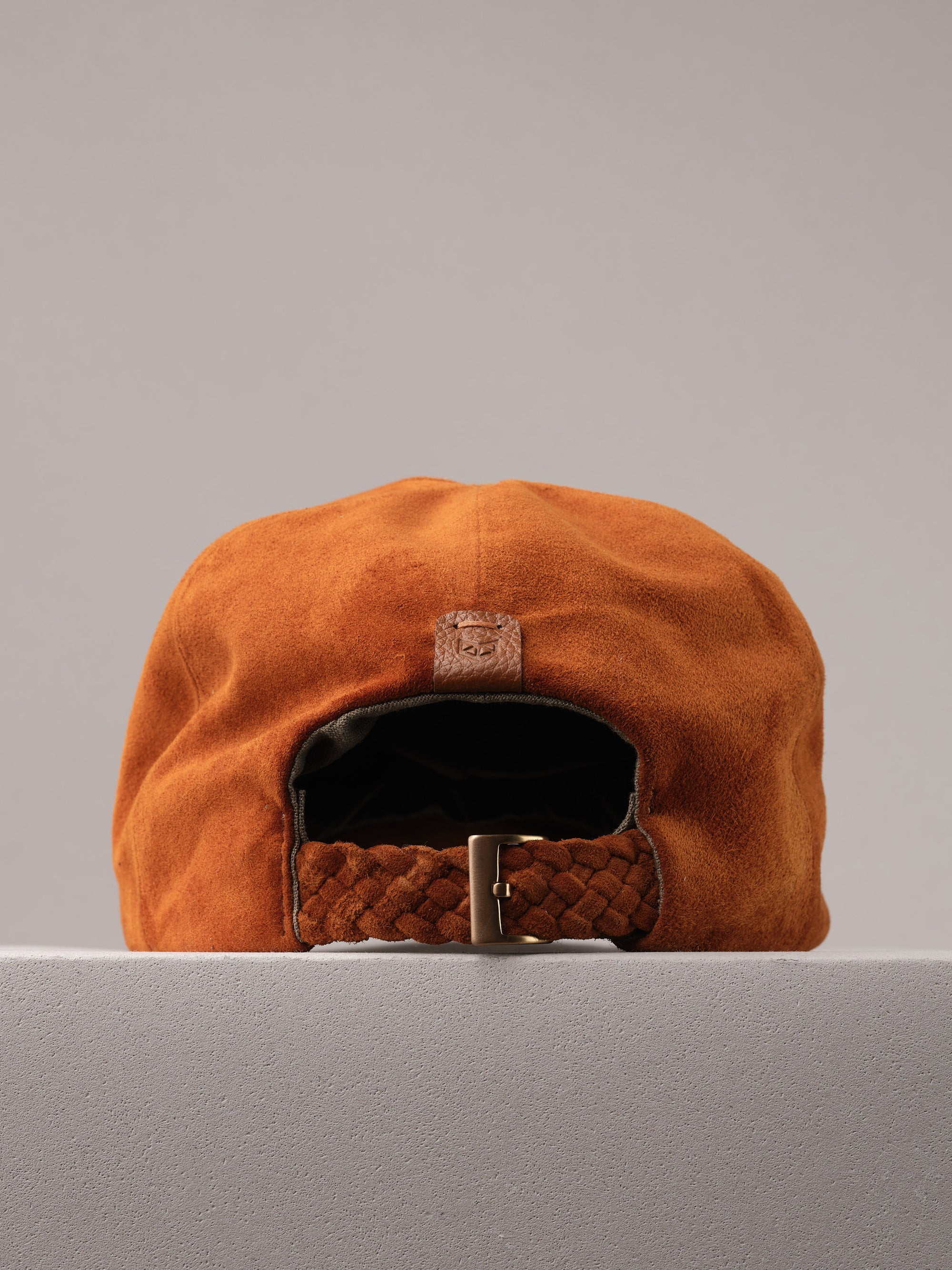 Capra Leather logo on the tan suede baseball cap.