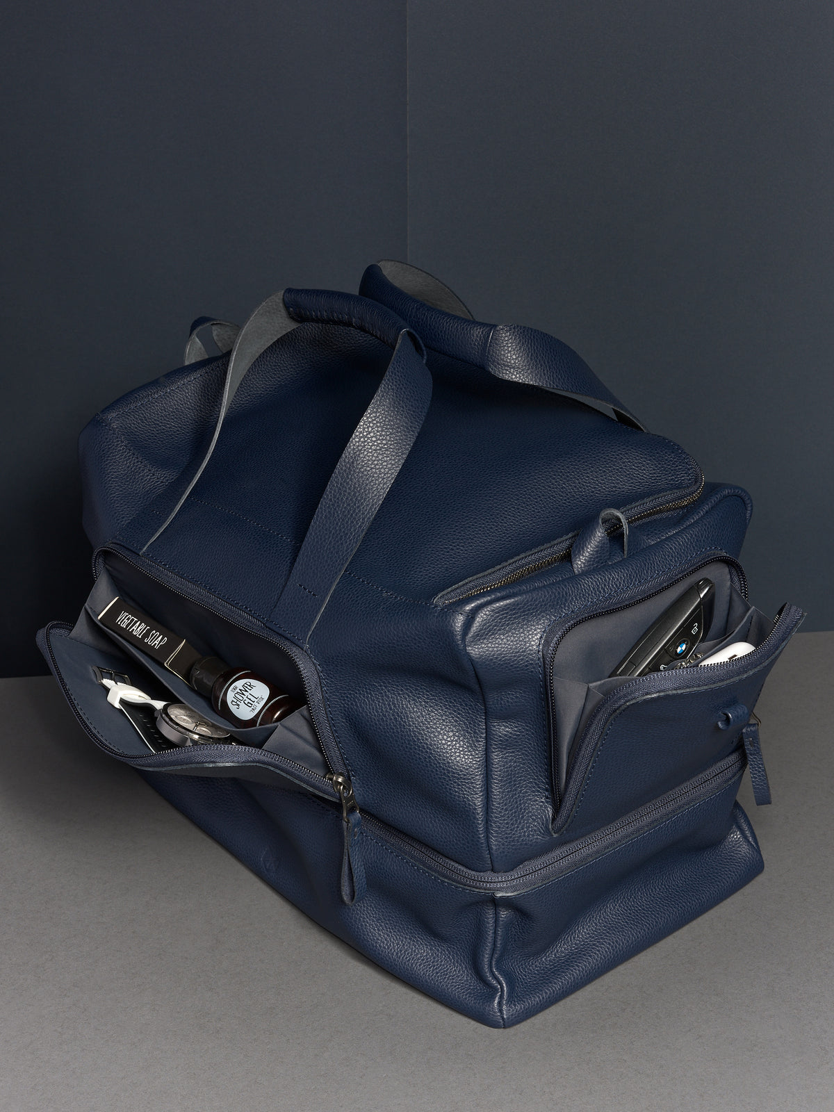 Ventra Holdall bag open, showing the main and side compartments filled with daily essentials.