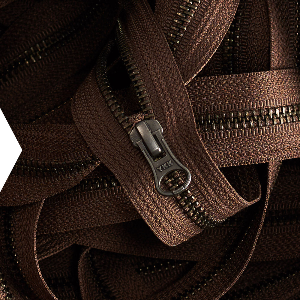 Close-up of brown YKK zippers used on Capra Leather bags