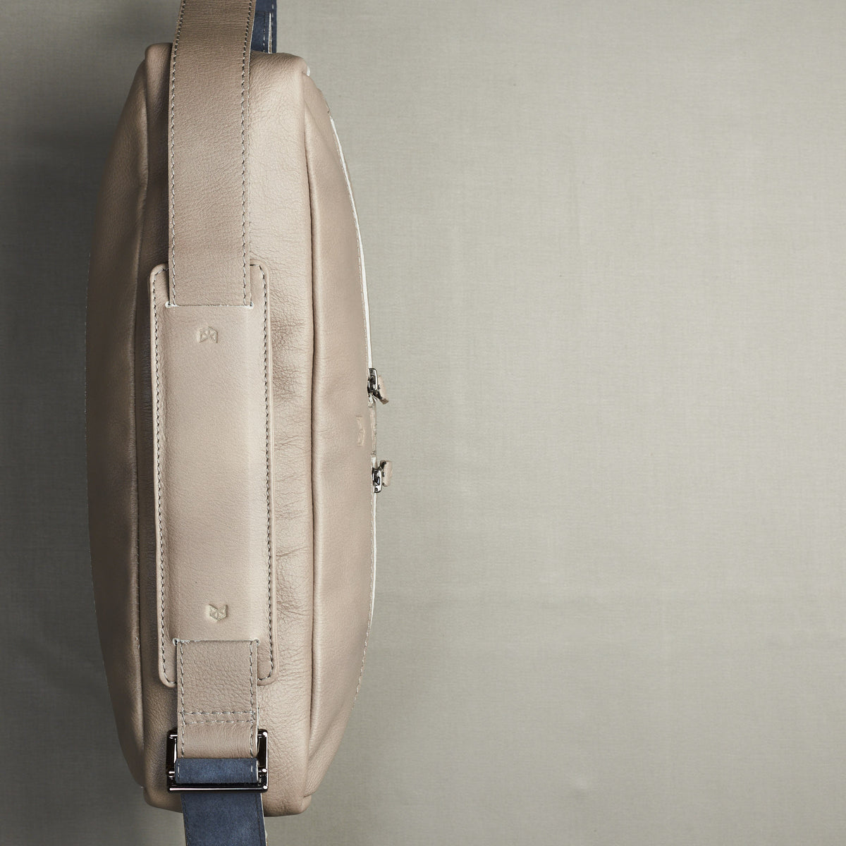 Aerial view. Grey handmade leather messenger bag for Men by Capra Leather. Macbook Pro 13 inch 15 inch leather bag. Unique mens bag 