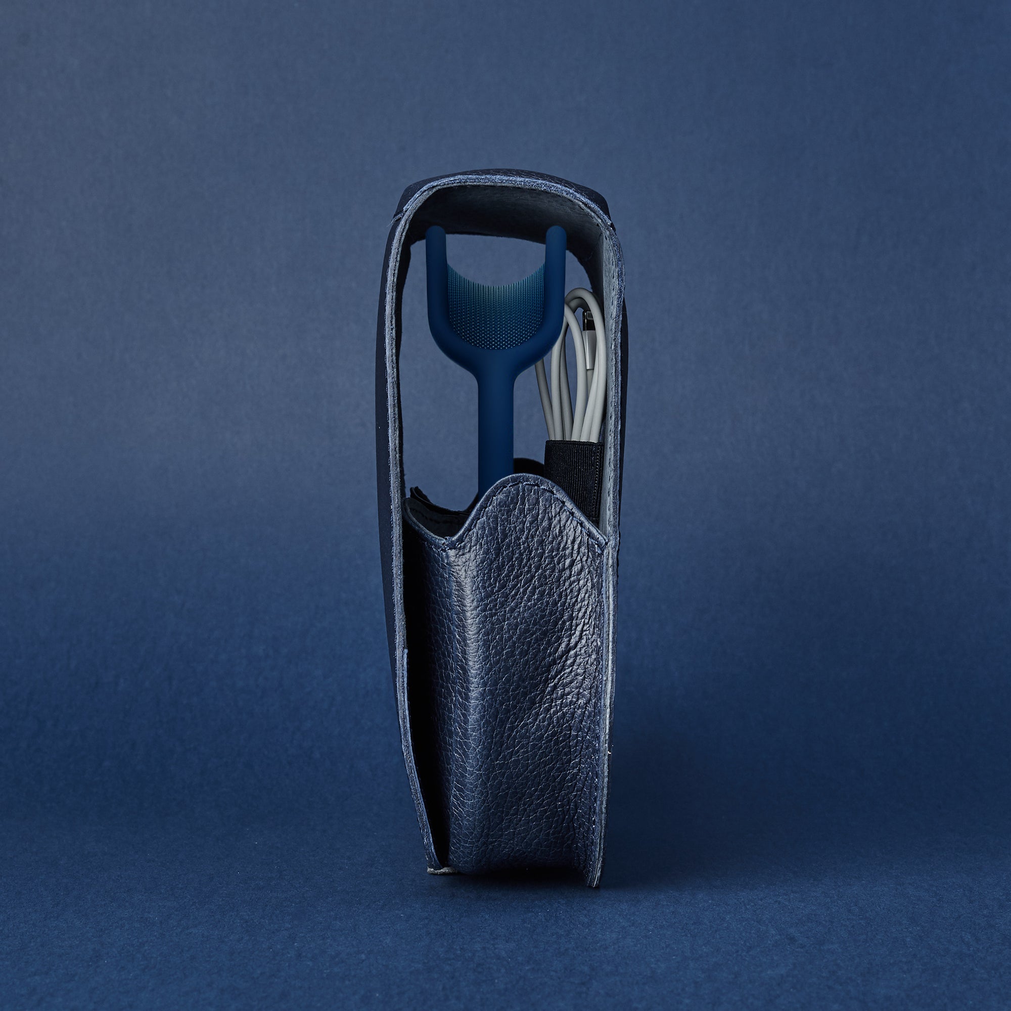 Side view. AirPods Max Case Shield Navy by Capra Leather