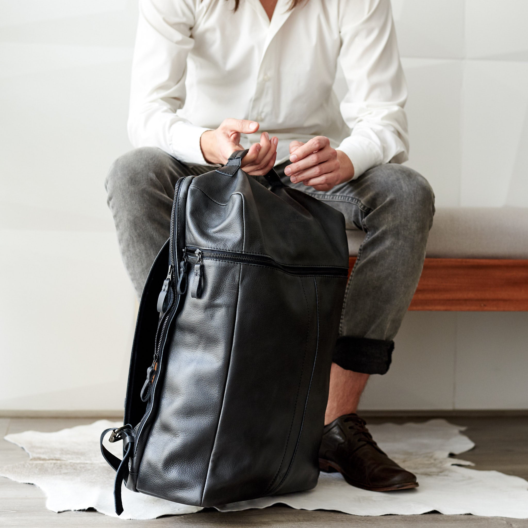 Black leather travel online backpack