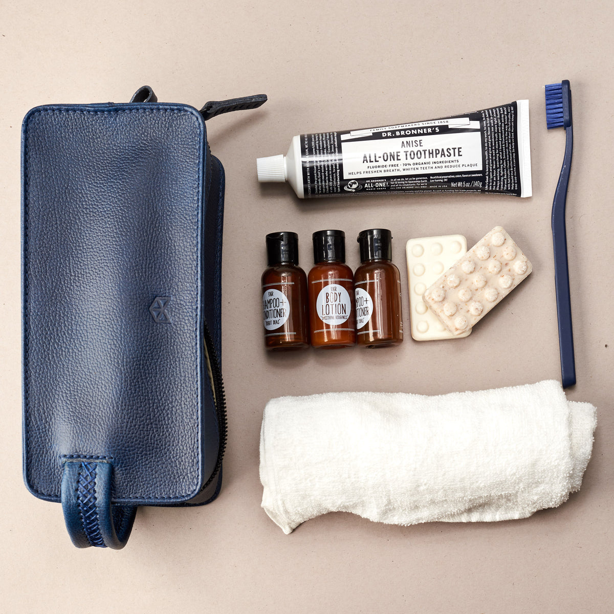 Styling. Ocean blue leather toiletry, shaving bag with hand stitched handle. Groomsmen gifts. Leather good crafted by Capra Leather 