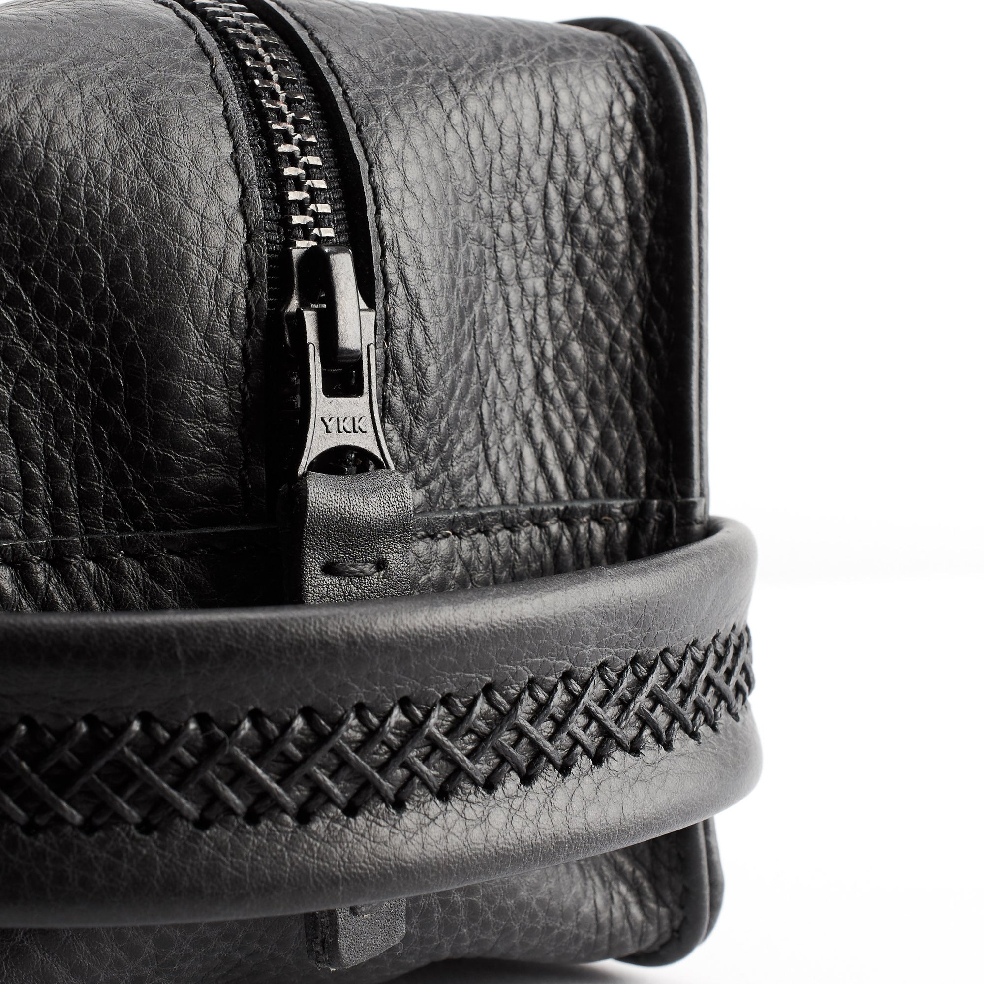 Handmade leather pull tabs, YKK metallic zippers details. Black toiletry bag