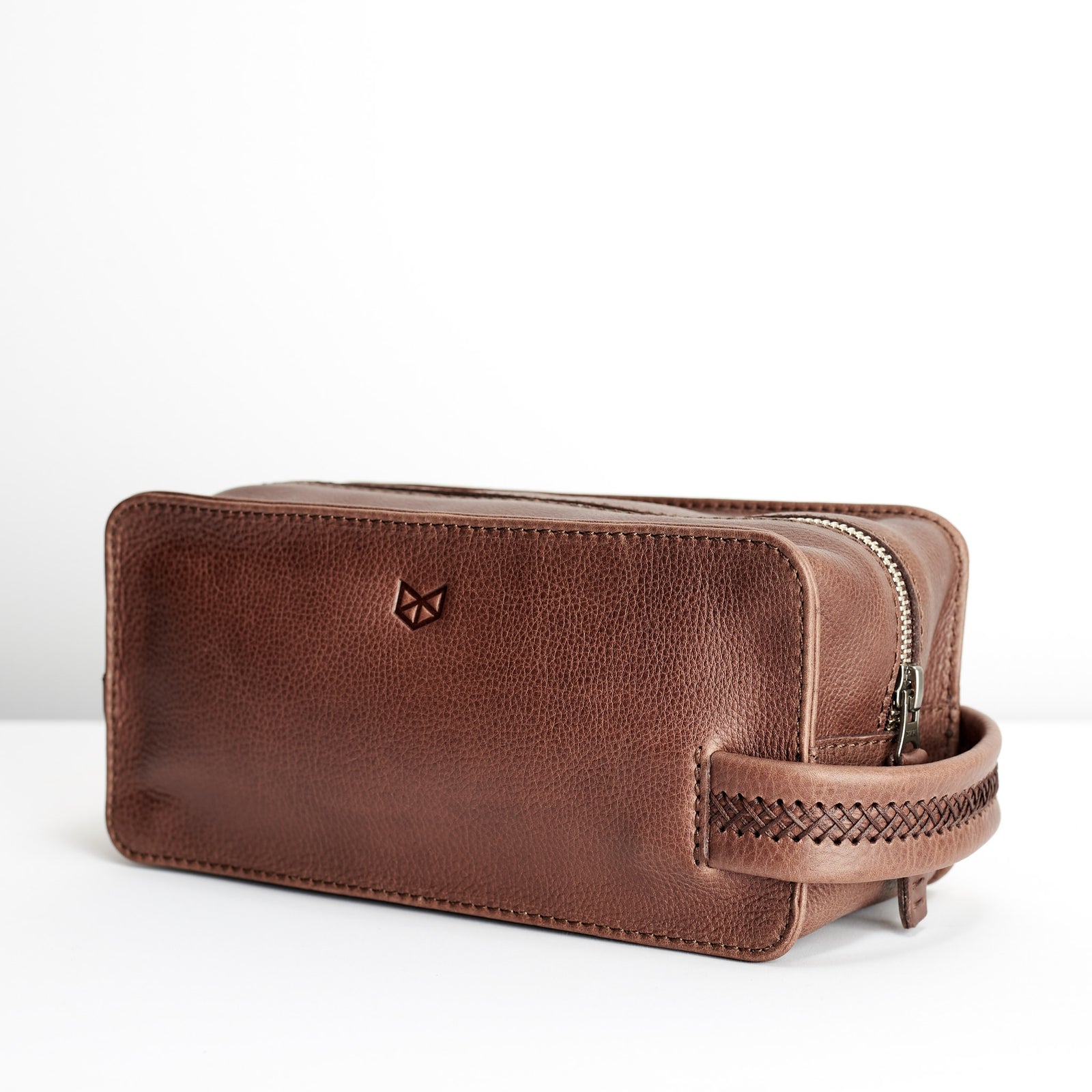 Dopp kit and toiletries. Brown leather toiletry, shaving bag with hand stitched handle