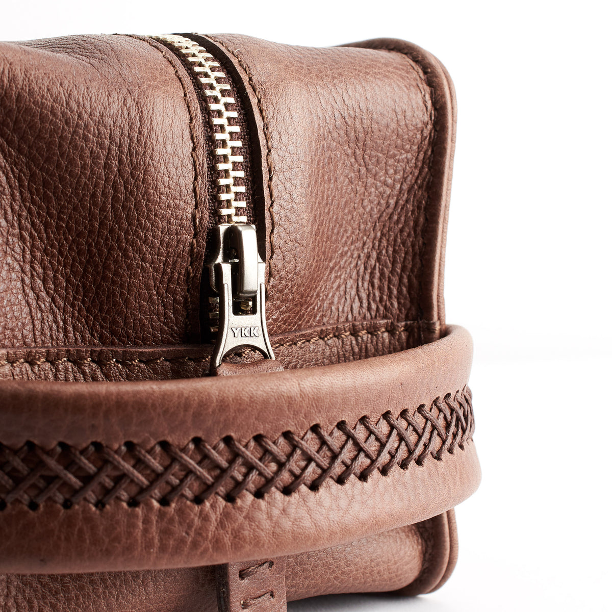 Close up. Brown leather toiletry, shaving bag with hand stitched handle