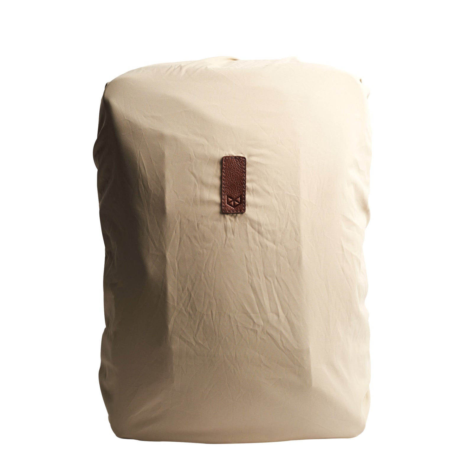 Front Beige Perfect fit for all Capra backpacks. Fashionable matte waterproof material. Leather details by Capra Leather.