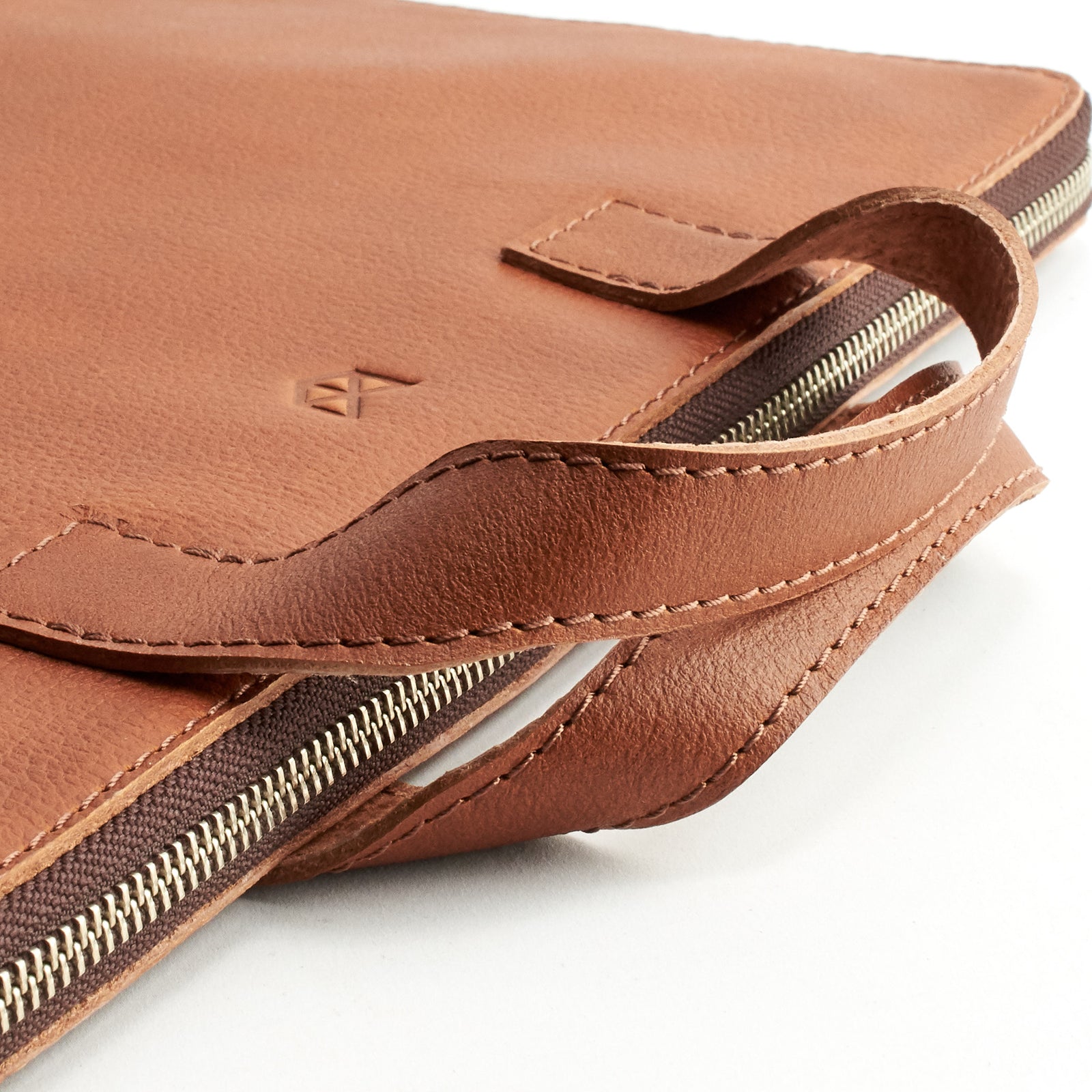 Handles detail. Tan leather laptop portfolio. Business document organizer for men.
