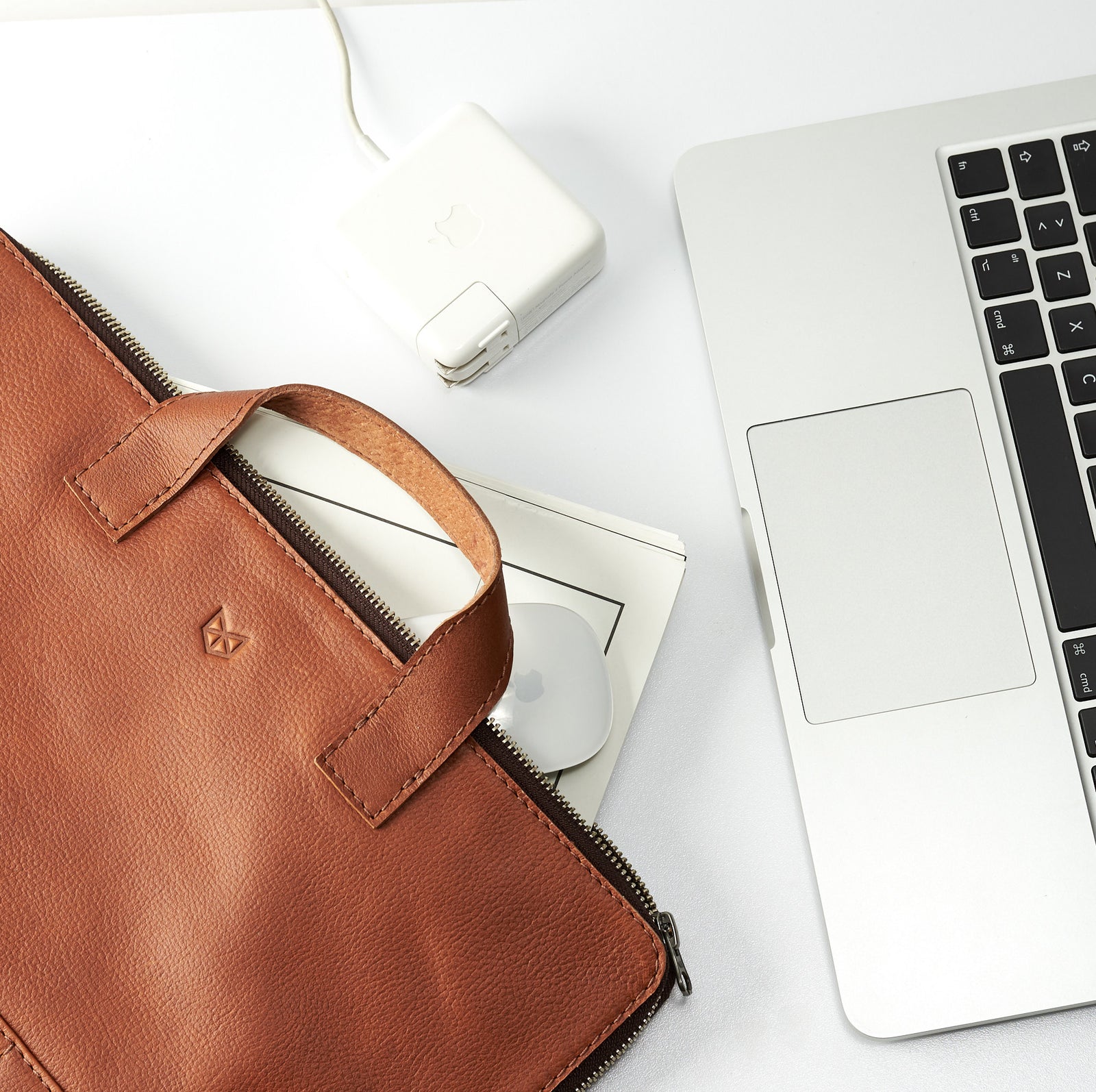 Desktop.  Tan leather laptop portfolio. Business document organizer for men. 