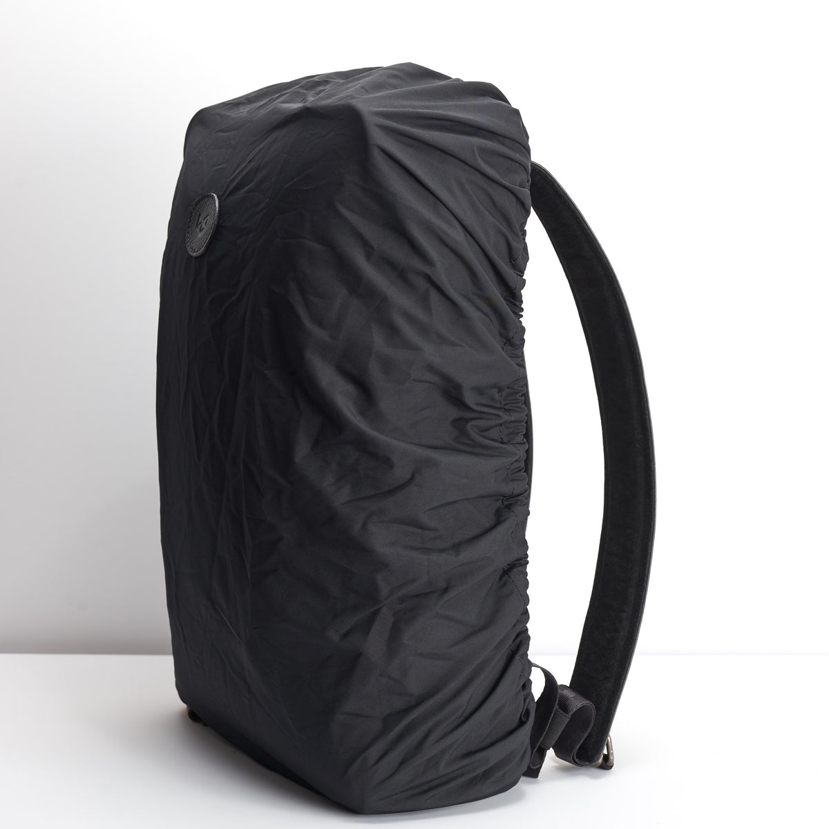 Black rain cover backpack accessory. Waterproof cape for Capra backpacks 