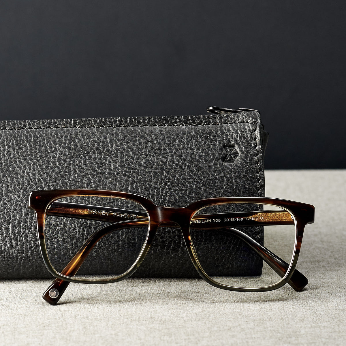 Style photo. Black leather glasses case for men. Eyewear mens leather cases