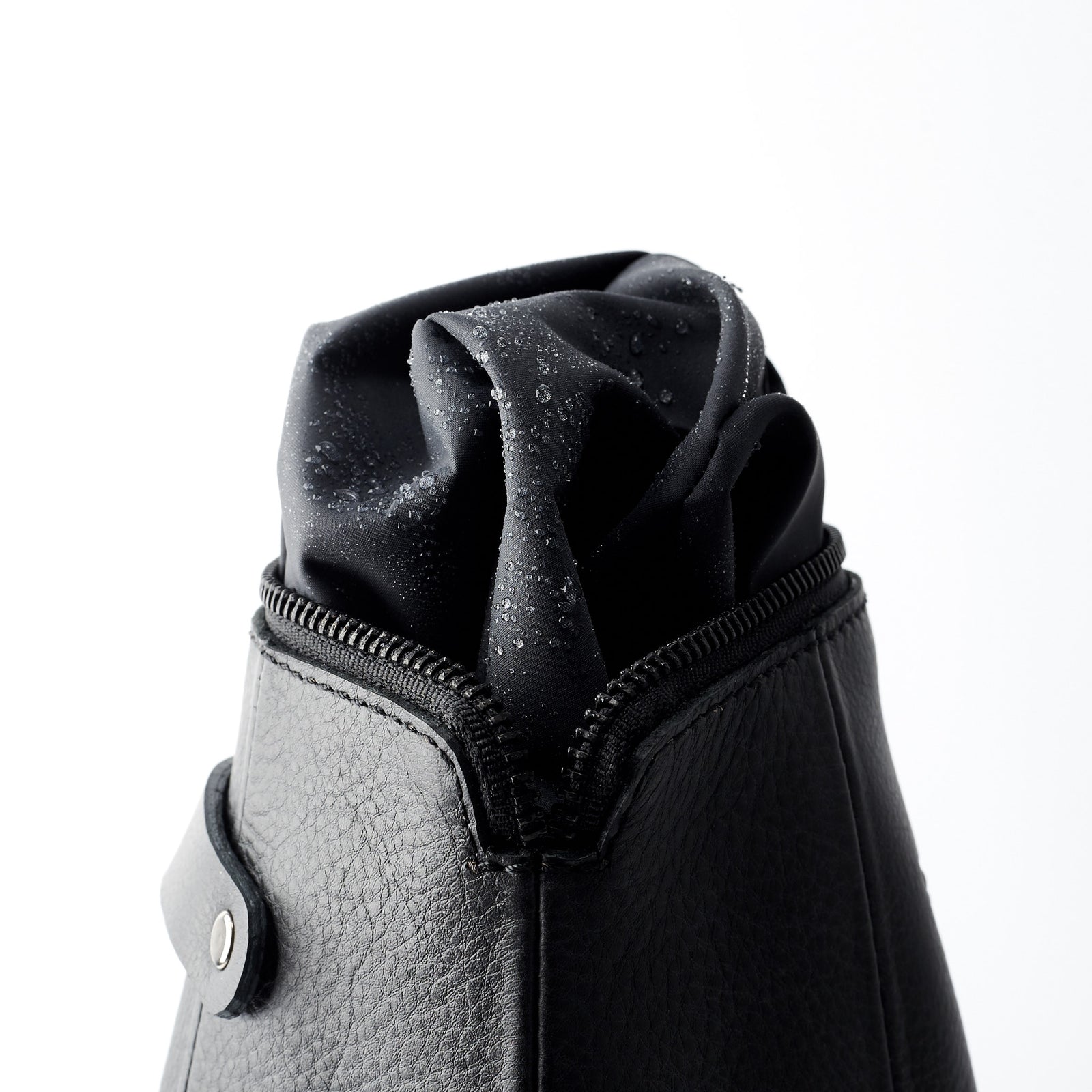 Detail, waterproof interior. Black leather boxer toiletry bag. Mens leather unique toiletry bag