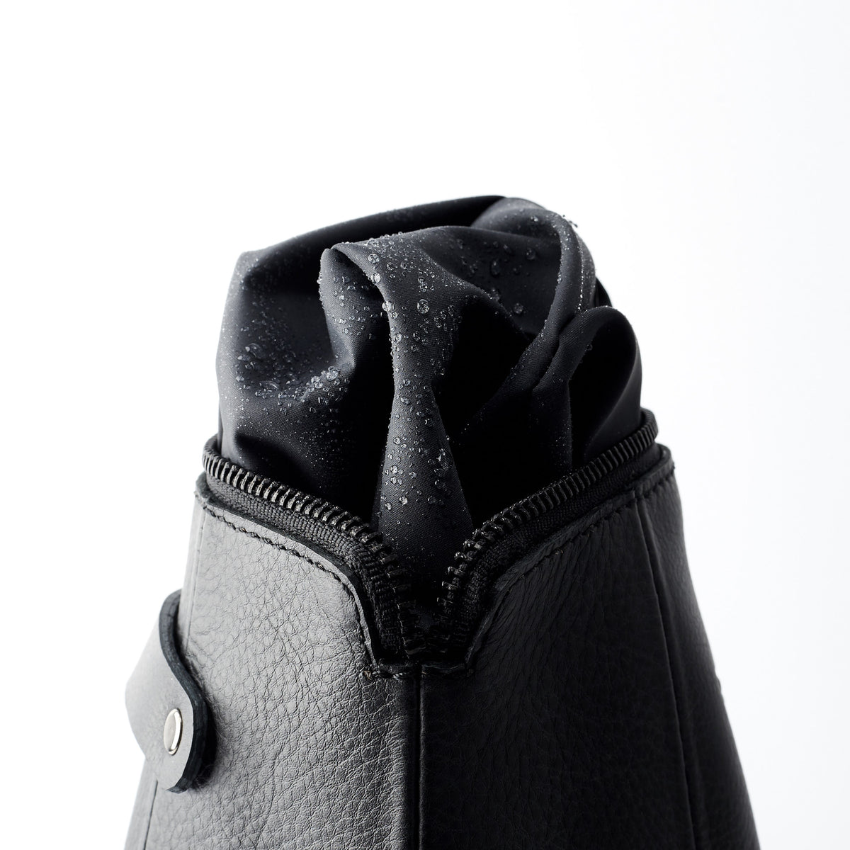 Detail, waterproof interior. Black leather boxer toiletry bag. Mens leather unique toiletry bag