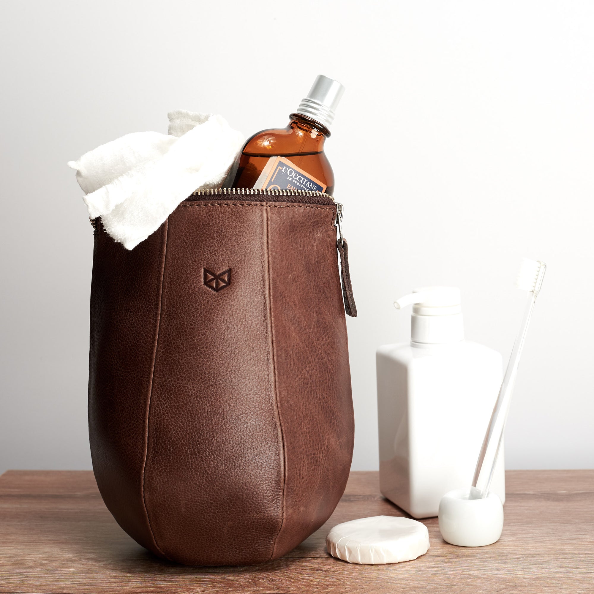 Travel Style photo. Brown leather toiletry dopp kit for men. Custom gifts for men