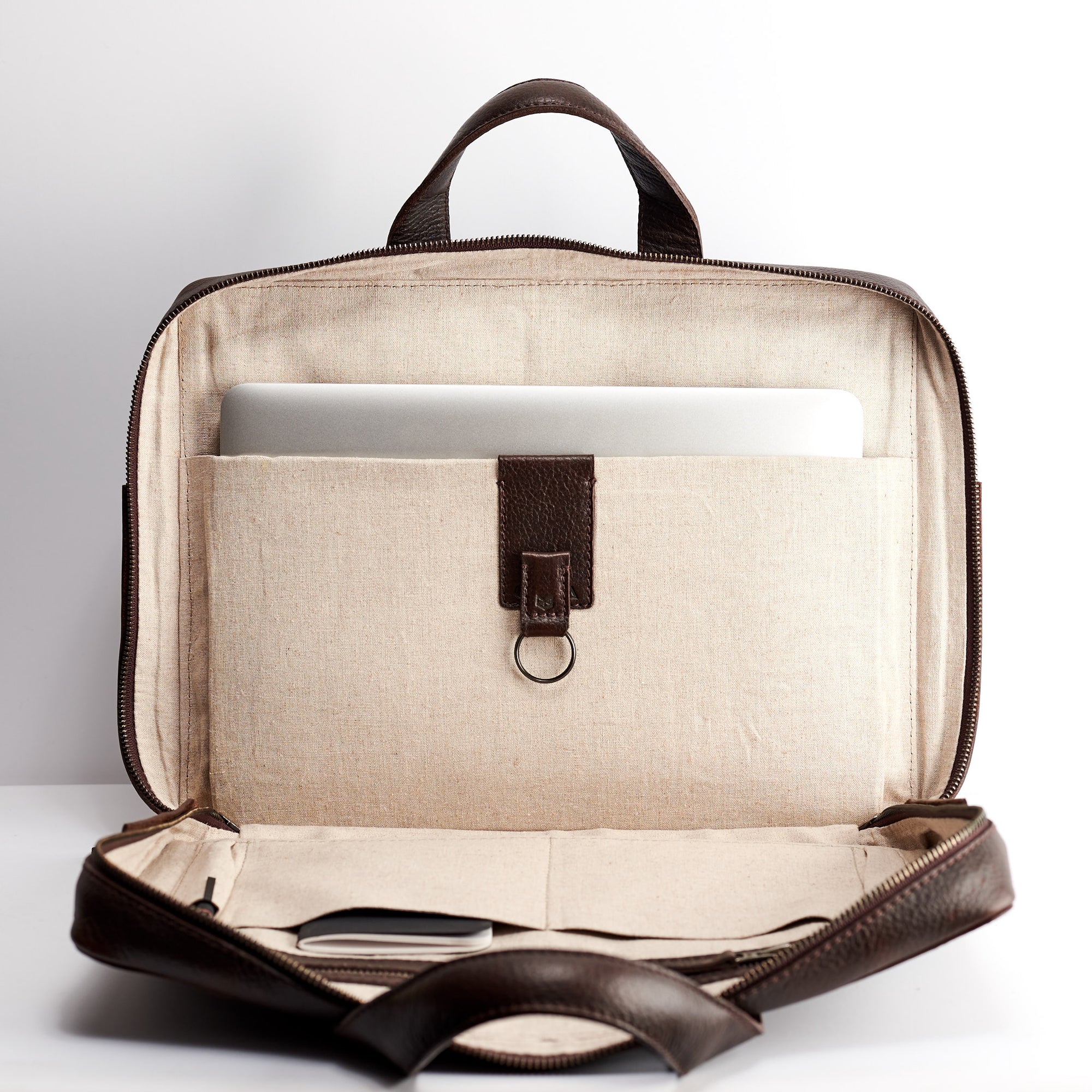 Interior pocket detail. Dark brown leather briefcase for men. Linen interior. Workbag for Macbook Pro 13inch 15inch