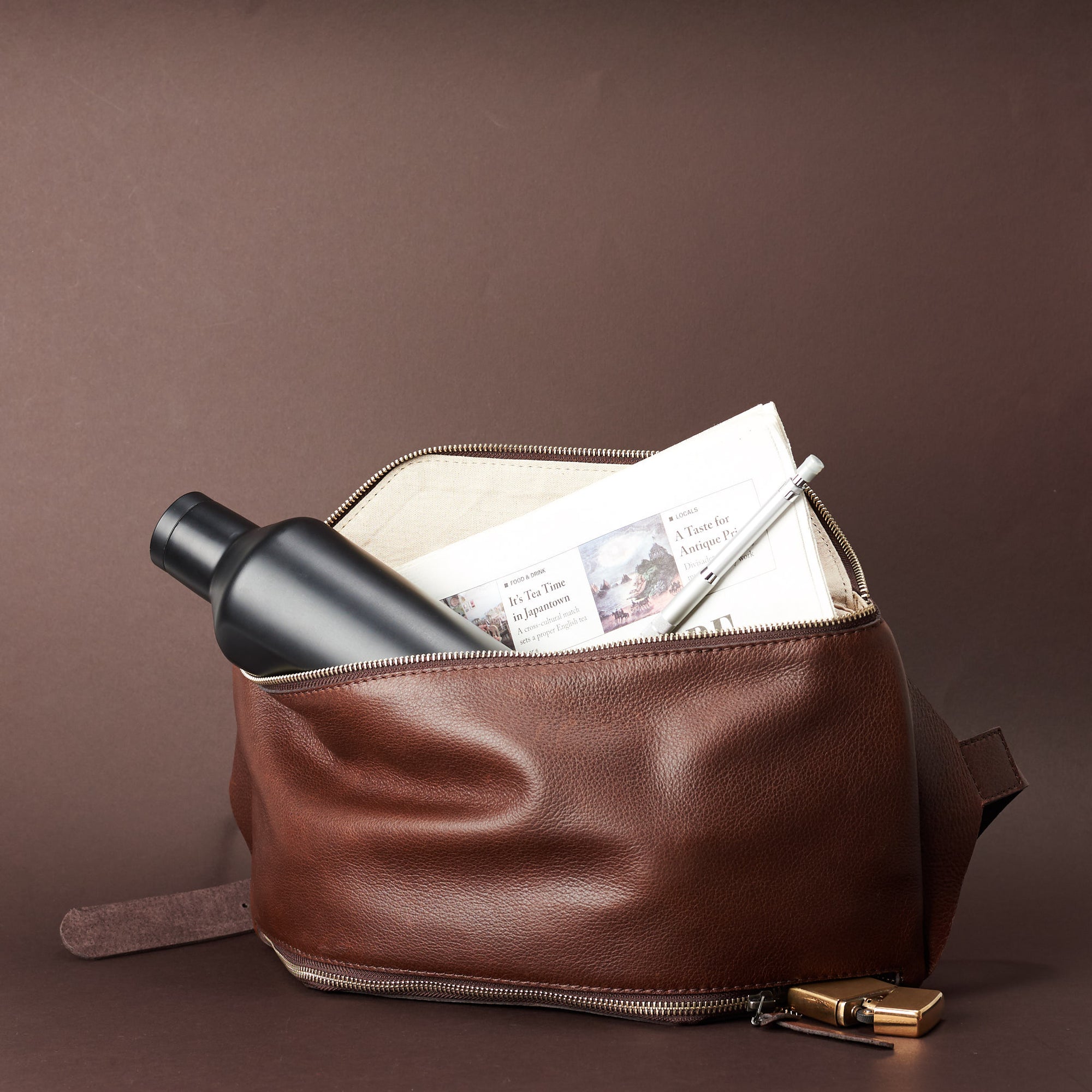 Styling with accessories. Fenek Sling Bag Brown by Capra Leather. 
