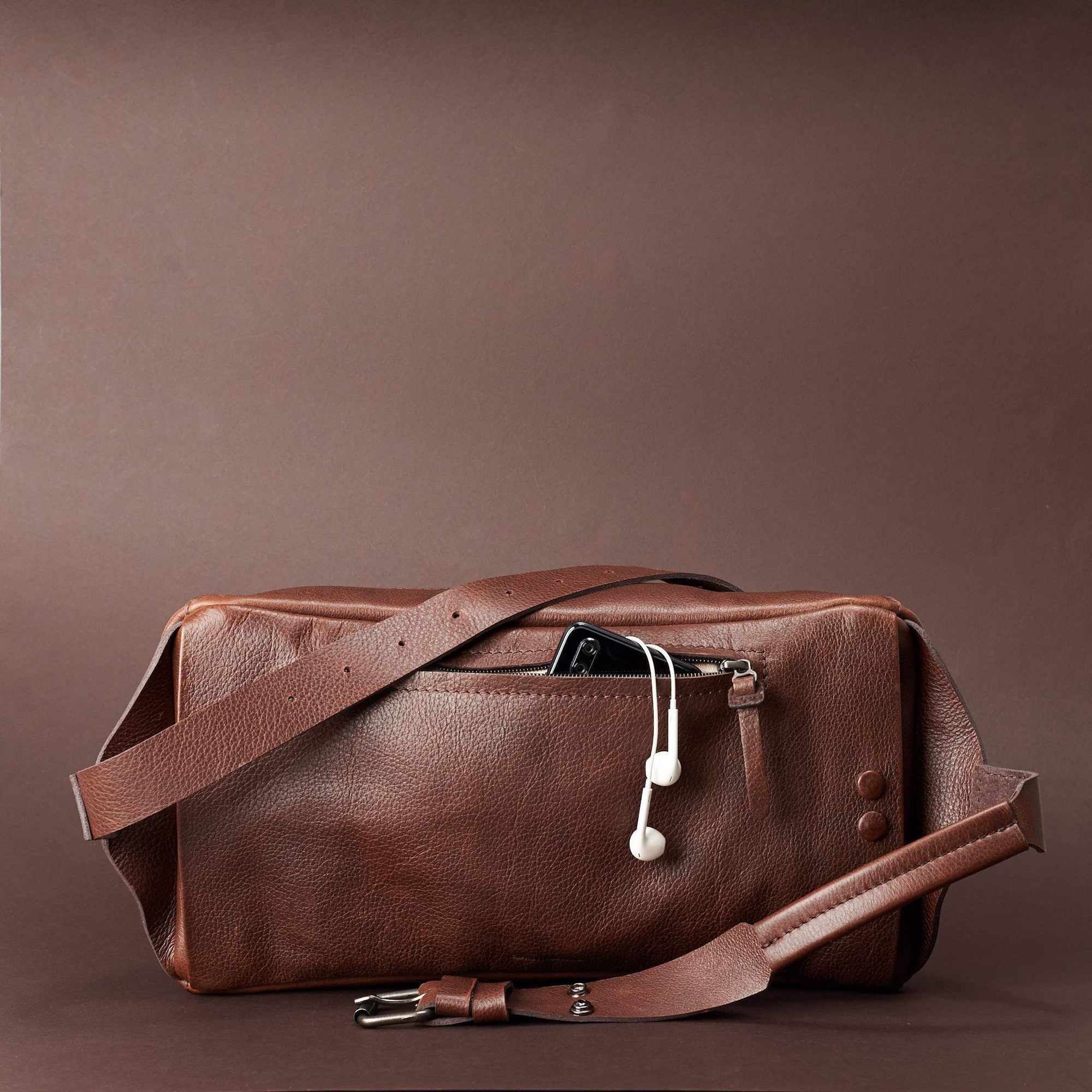 Styling back pocket of leather crossbody for easy access. Fenek Sling Bag Brown by Capra Leather