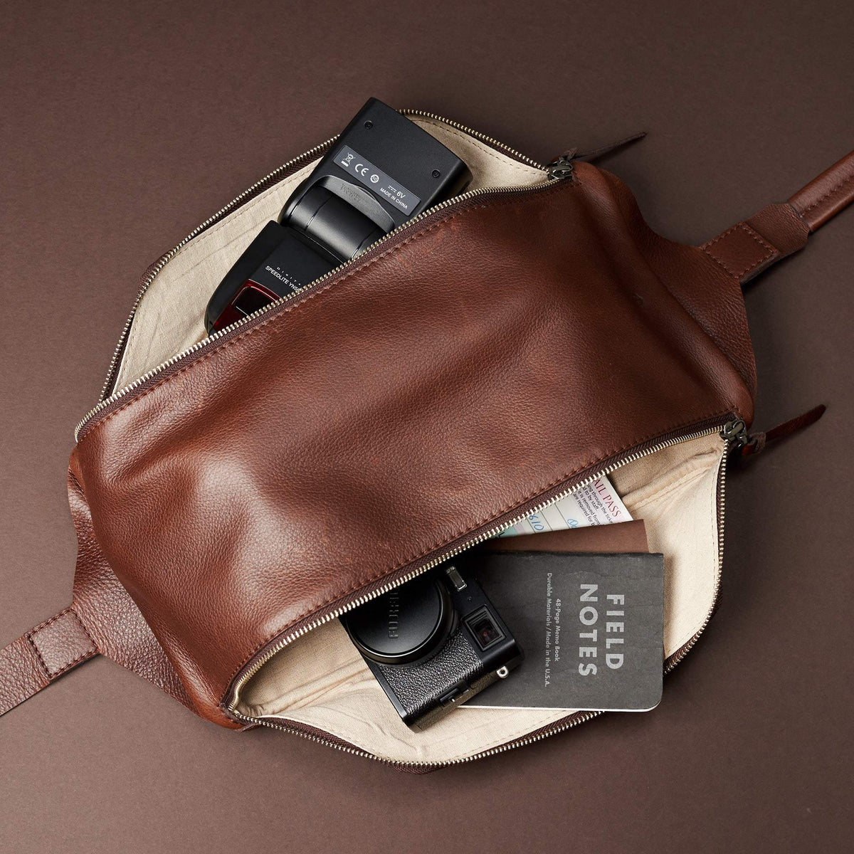 Styling medium and small compartment. Fenek Sling Bag Brown by Capra Leather