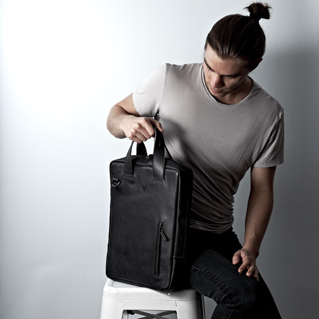 Style photo. Minimalist leather briefcase. Unique briefcase style