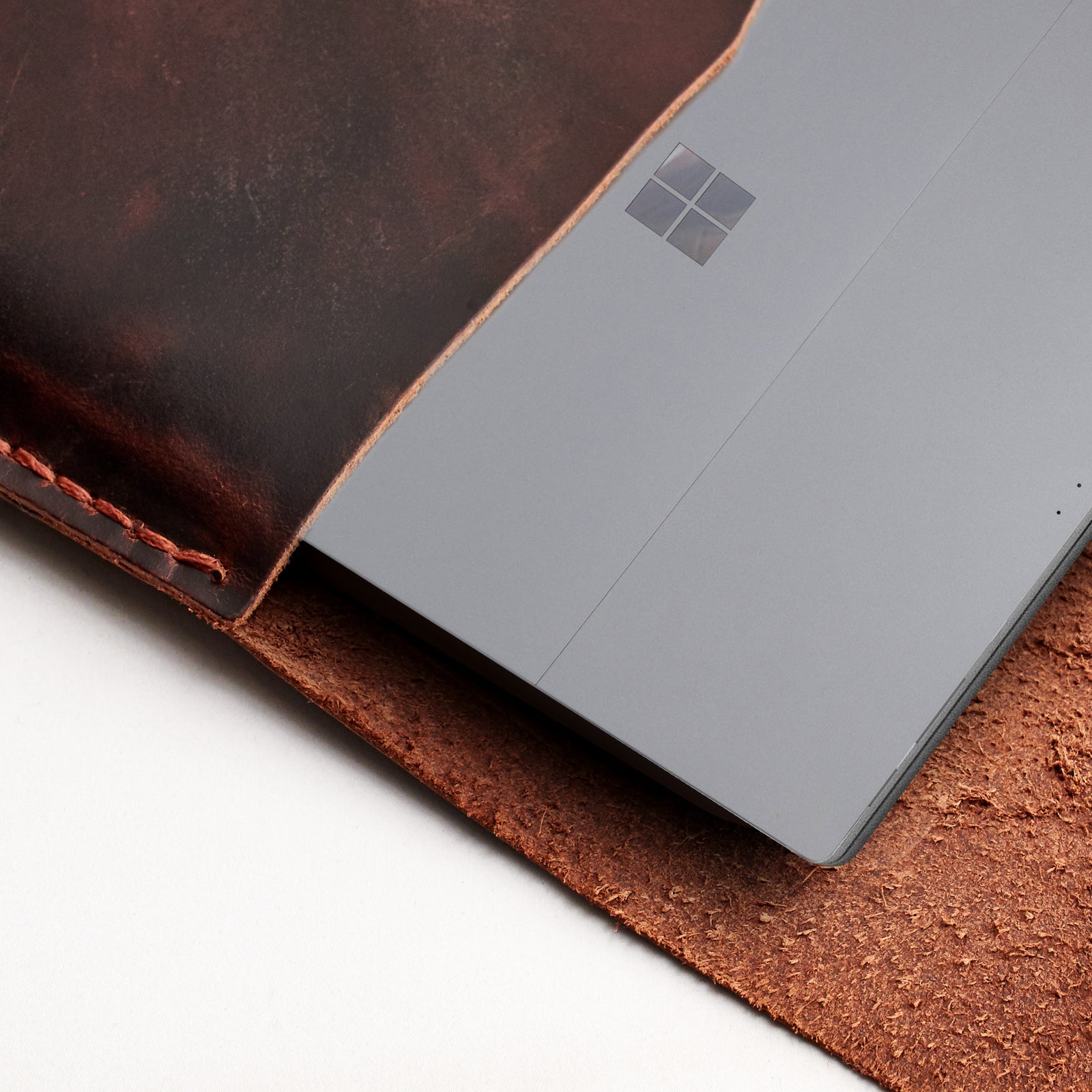 Interior detail. Red brown  leather Surface sleeve. Designer unique mens cases.