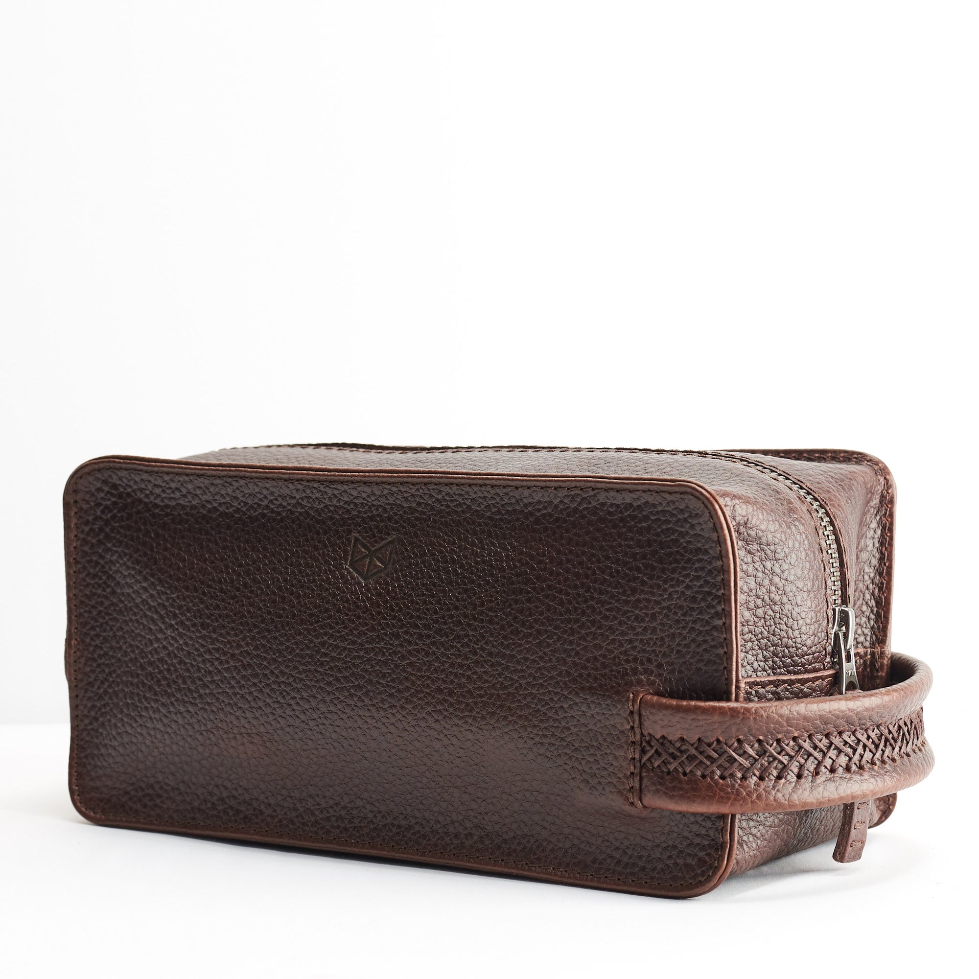Angle. Dark Brown leather toiletry, shaving bag with hand stitched handle. Groomsmen gifts