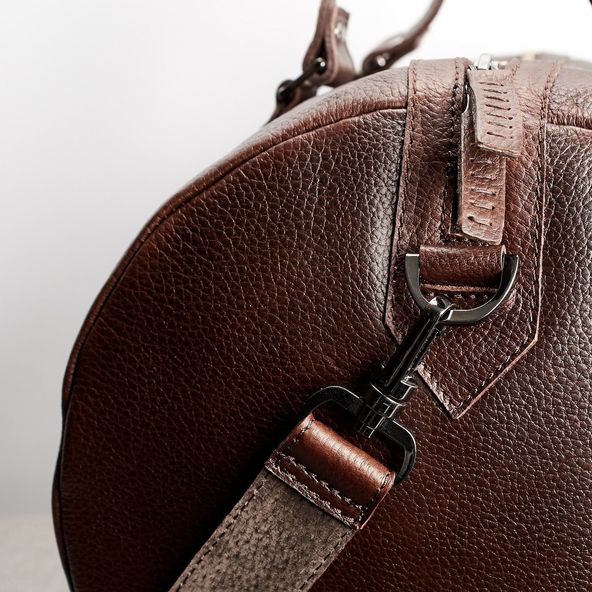 Carrying strap. Dark brown leather carryall bag. Mens travel weekender bag