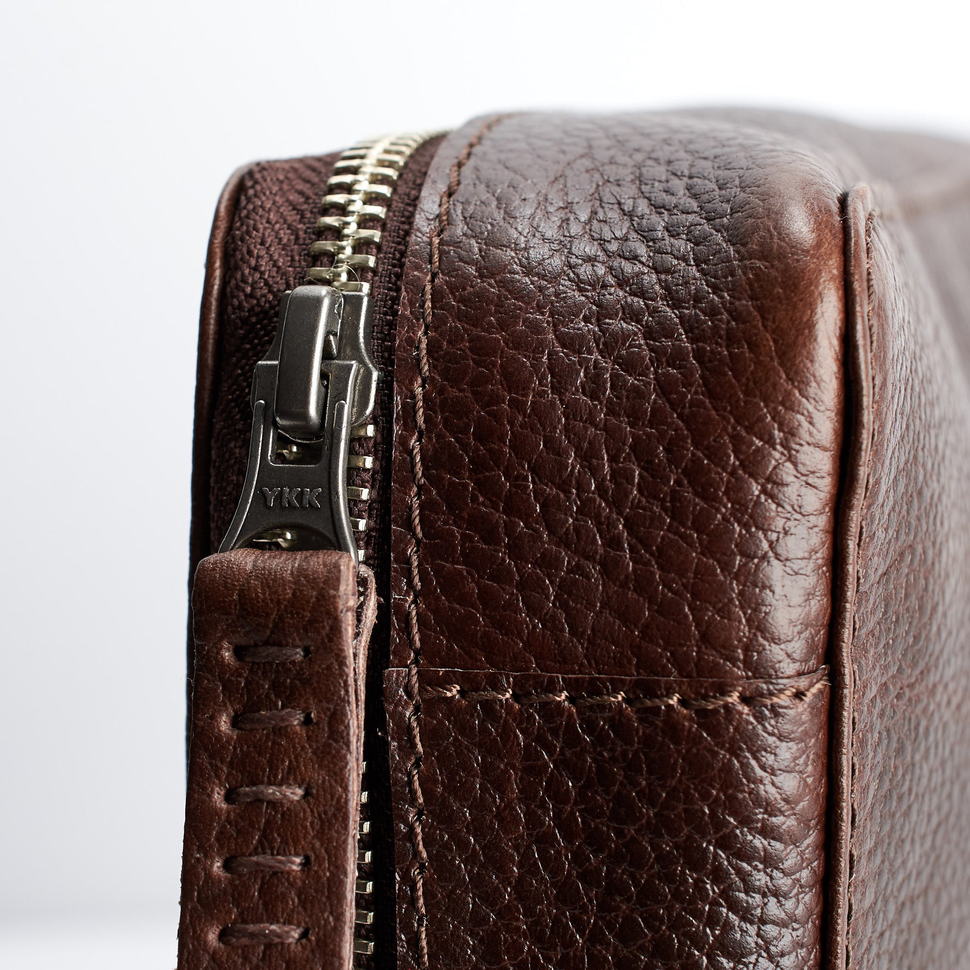 Hand stitched pull tabs. Dark Brown leather tech bags by Capra. Fits iPad Pro with pencil