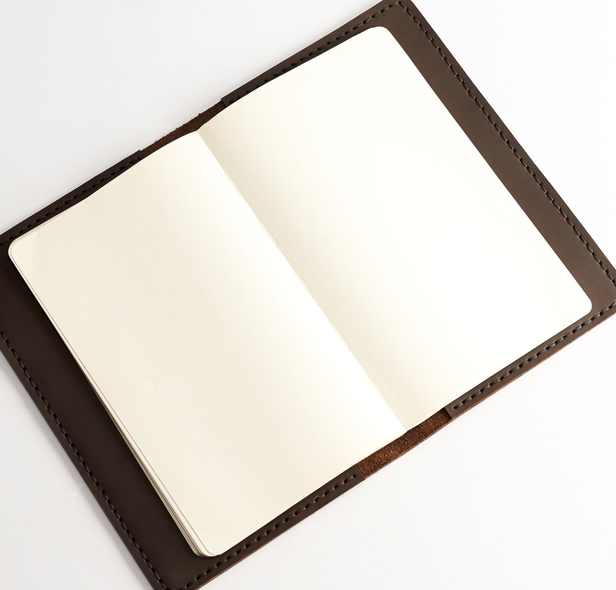 Open. Entirely hand stitched Moleskine Large and Pocket leather cover. Traveler's journal case. Customize your notebook with our handmade case. 