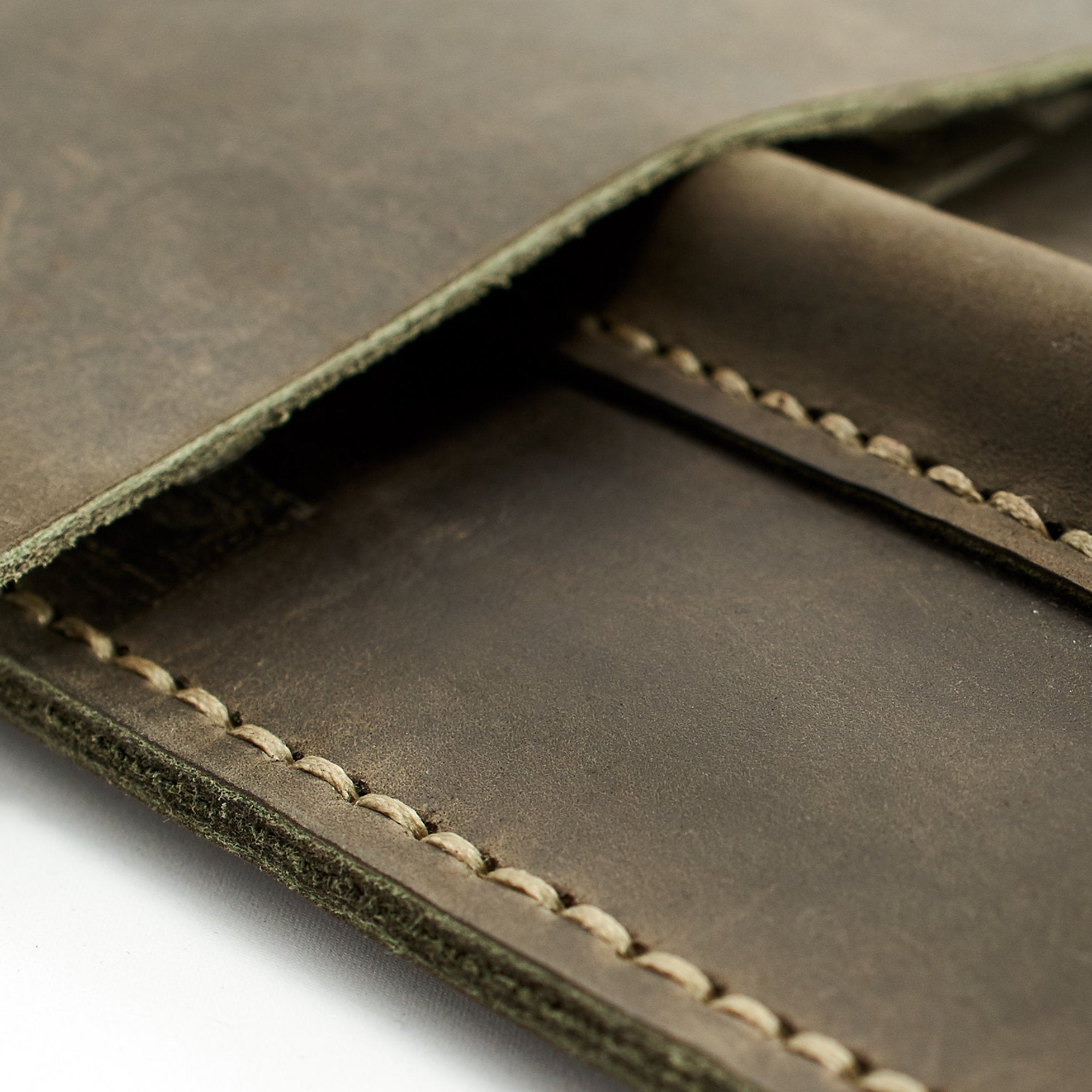 Stitch detail. Green leather reMarkable tablet case. Folio with Marker holder. Paper E-ink tablet cover