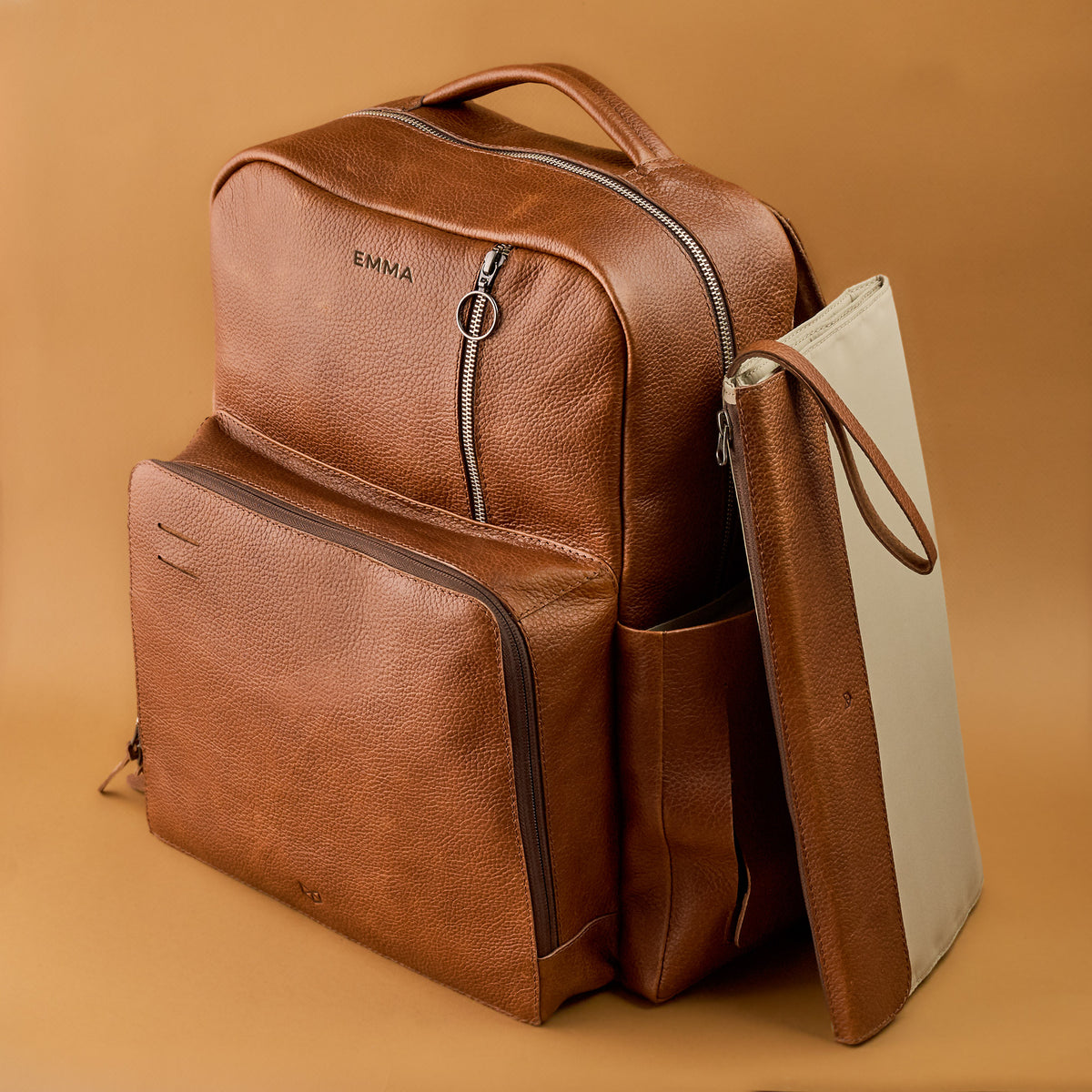 tan leather diaper bag by capra