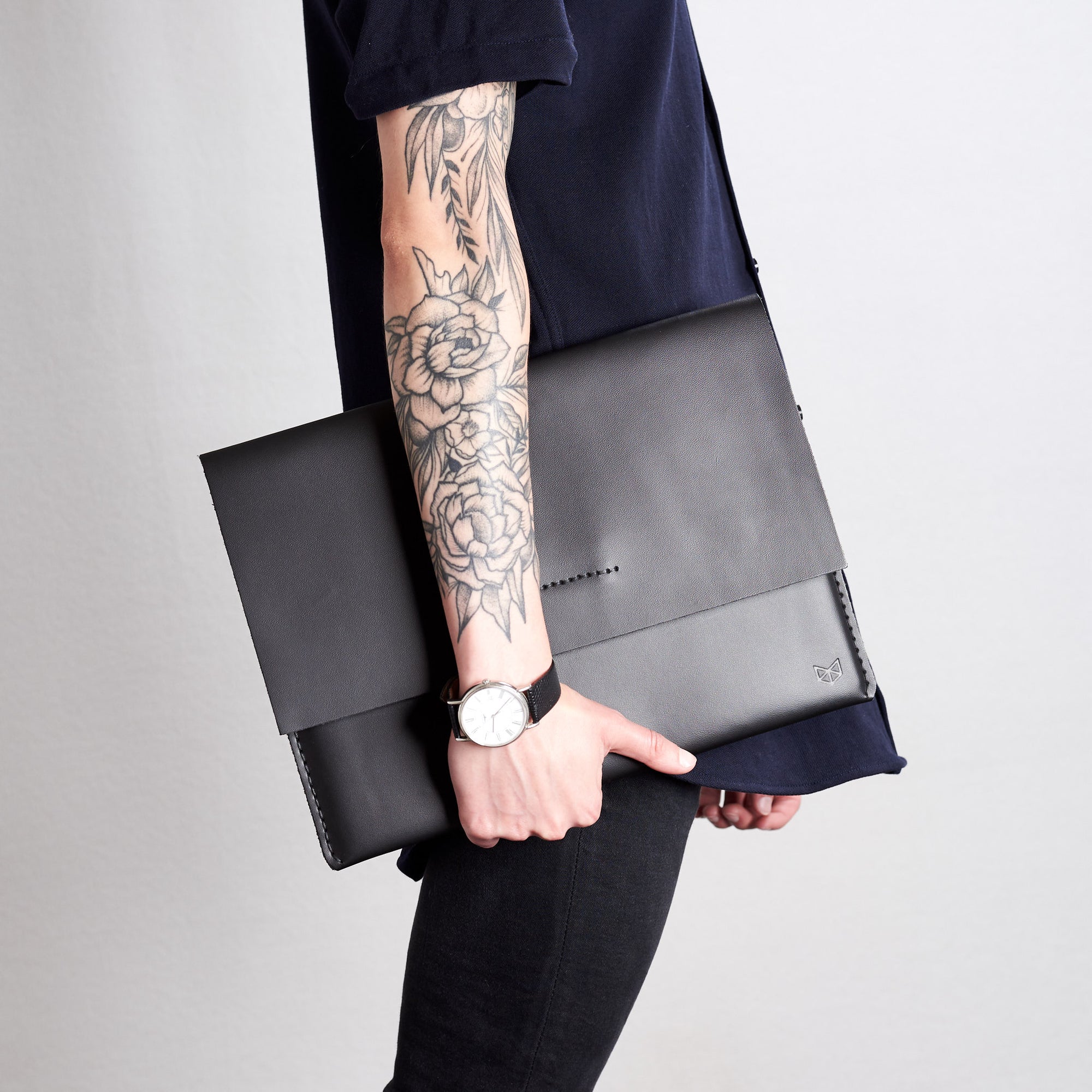Style side walking view. Black draftsman 1 case by Capra Leather. Microsoft Surface sleeve.