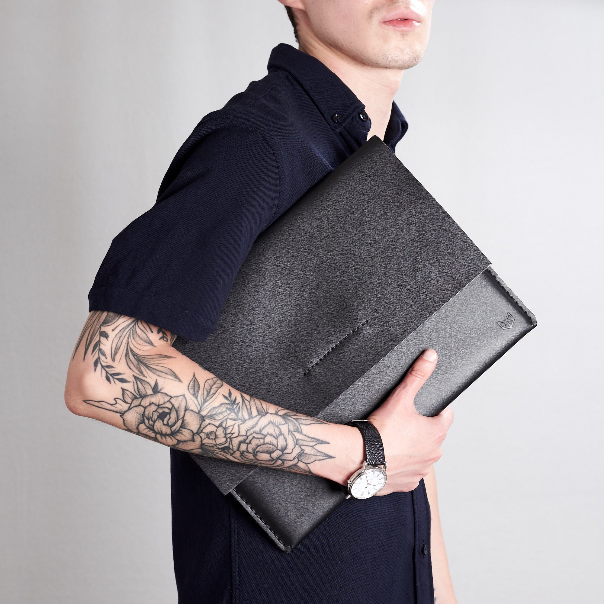 Style front view. Black draftsman 1 case by Capra Leather. Microsoft Surface sleeve.