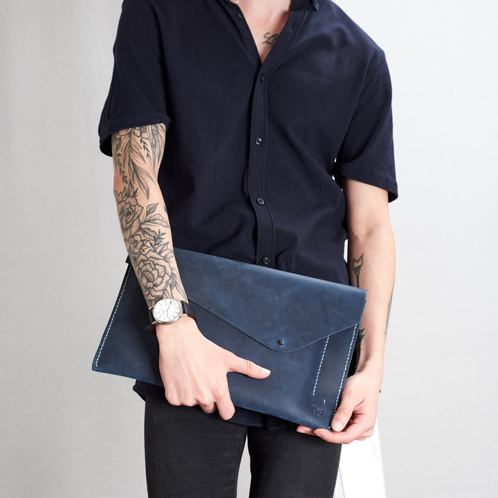 Style front view. Blue draftsman 5 case by Capra Leather. Microsoft Surface sleeve.